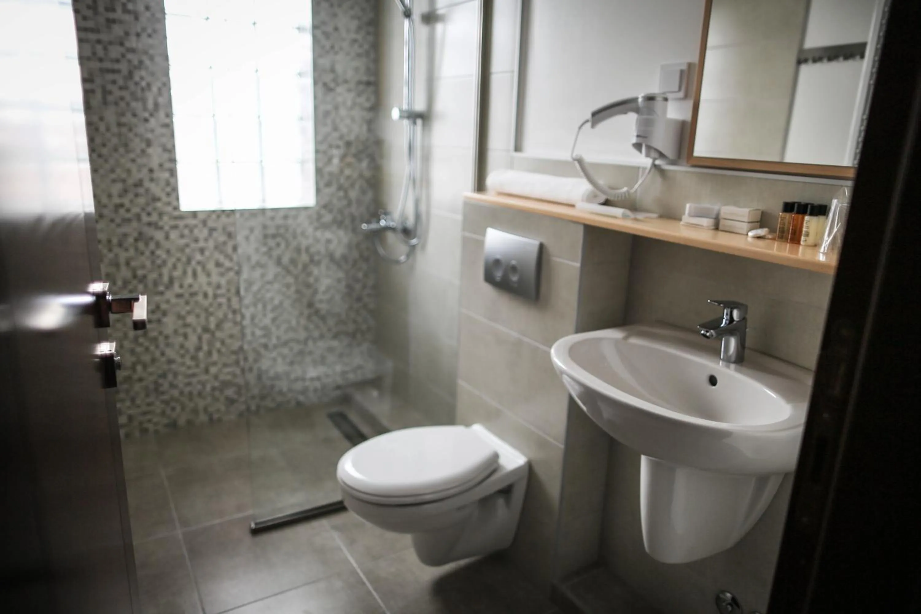 Shower in GARNI HOTEL ATRIUM