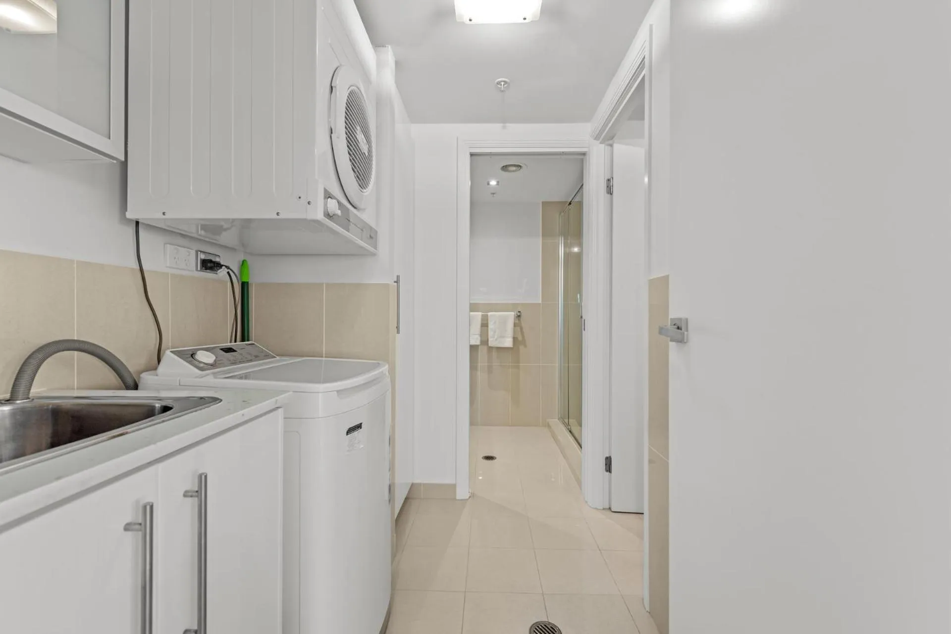 washing machine in Proximity Waterfront Apartments