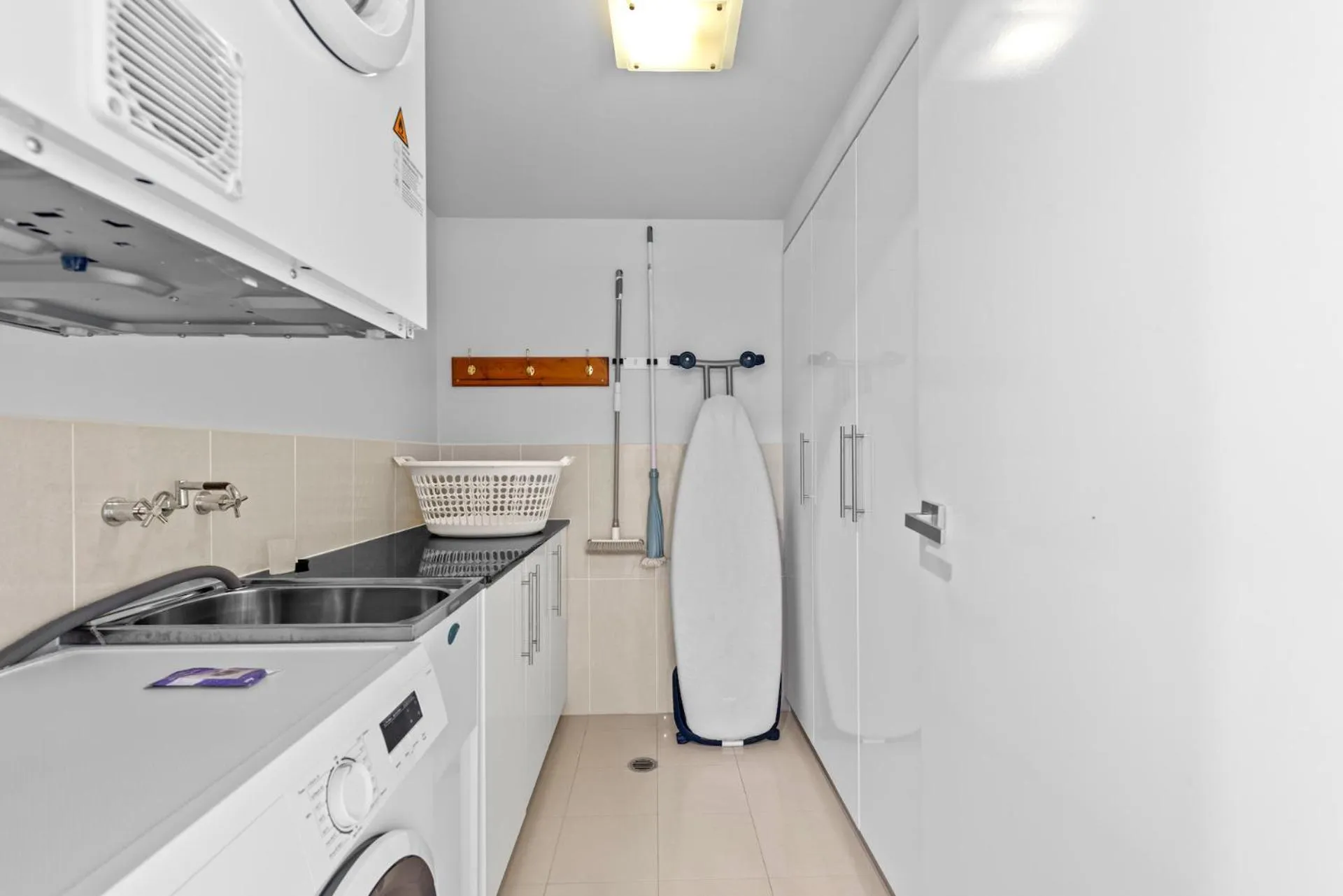 washing machine in Proximity Waterfront Apartments