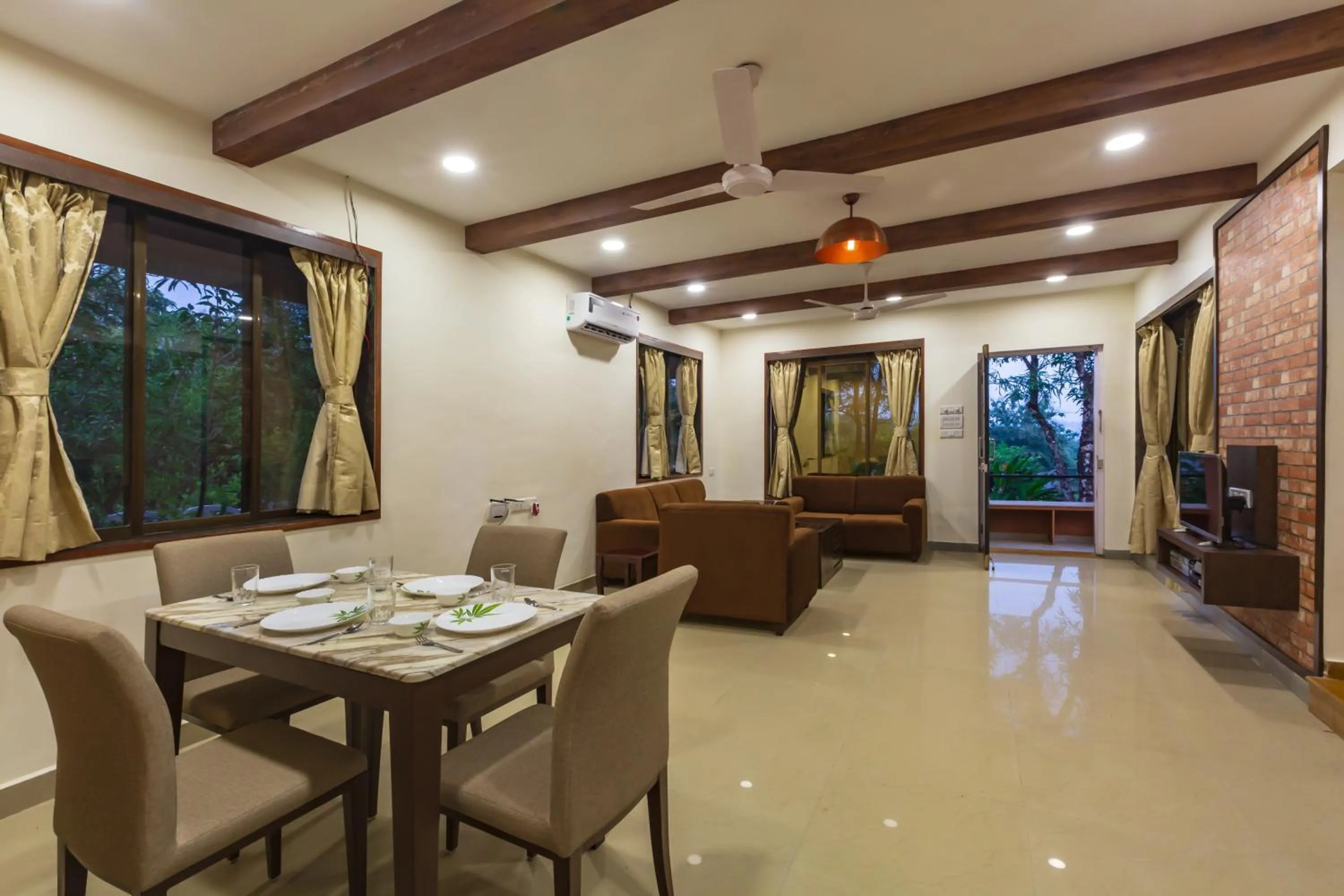 Day in SaffronStays Ekaant- 3BR pet-friendly pool villa with lawn, games & river walk in gated community near Mumbai
