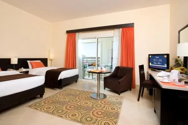Living room, Bed in Swiss Inn Teda Hotel & Aqua Park