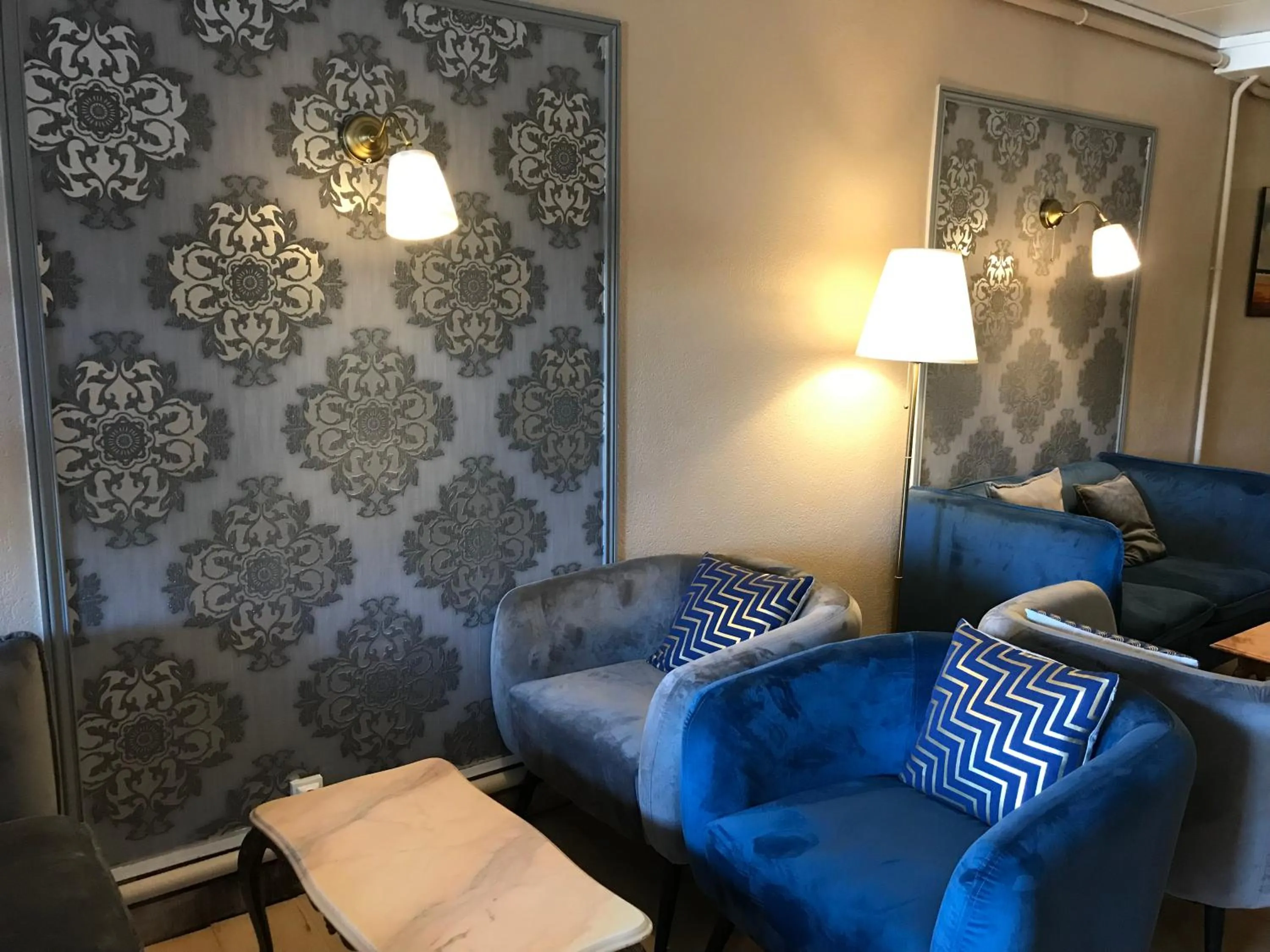 Seating area in Hotel du Centre - Restaurant le P'tit Gourmet