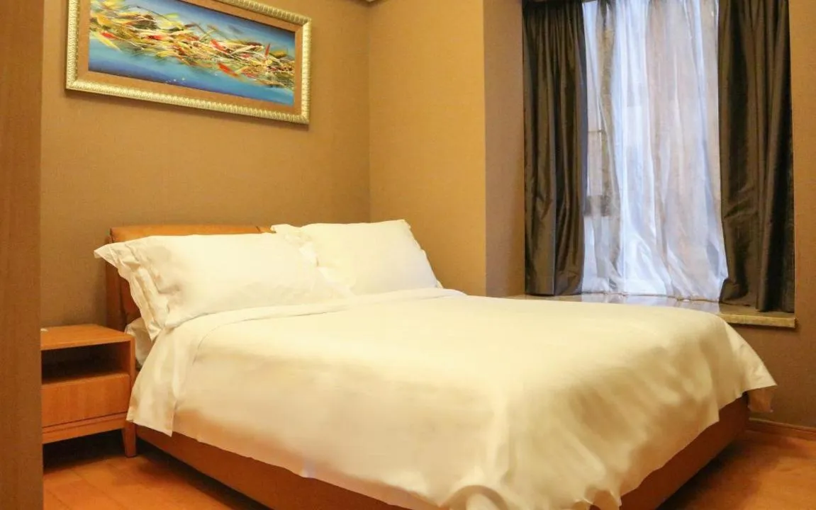 Bed in 广州丹顿行政公寓-Dan Executive Apartment Guangzhou Zhujiang New Town