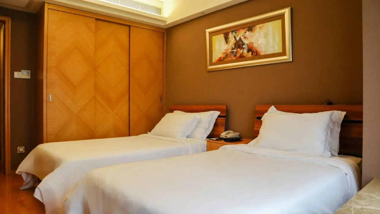 Bed in 广州丹顿行政公寓-Dan Executive Apartment Guangzhou Zhujiang New Town