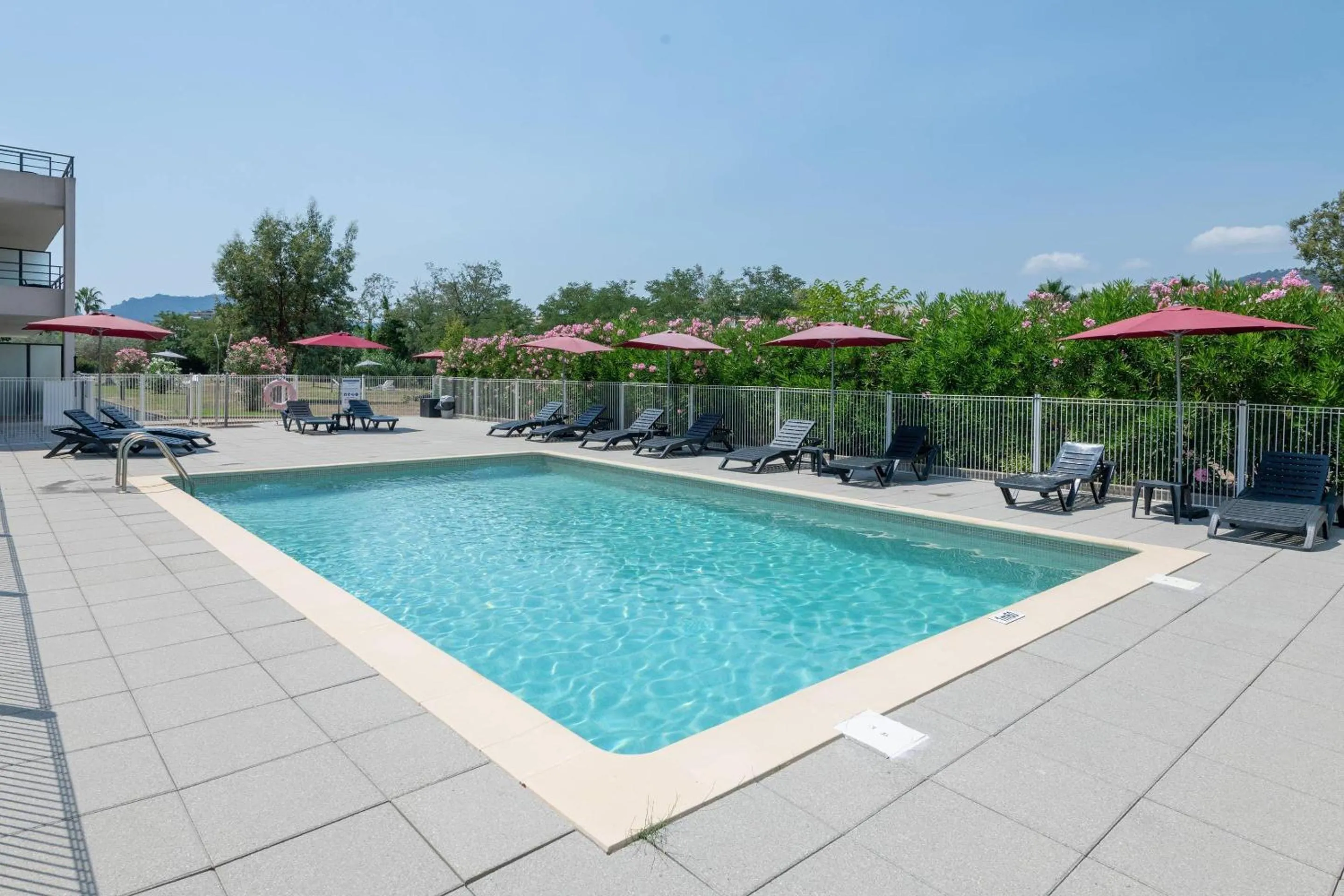 Swimming pool in Comfort Aparthotel Cannes Mandelieu