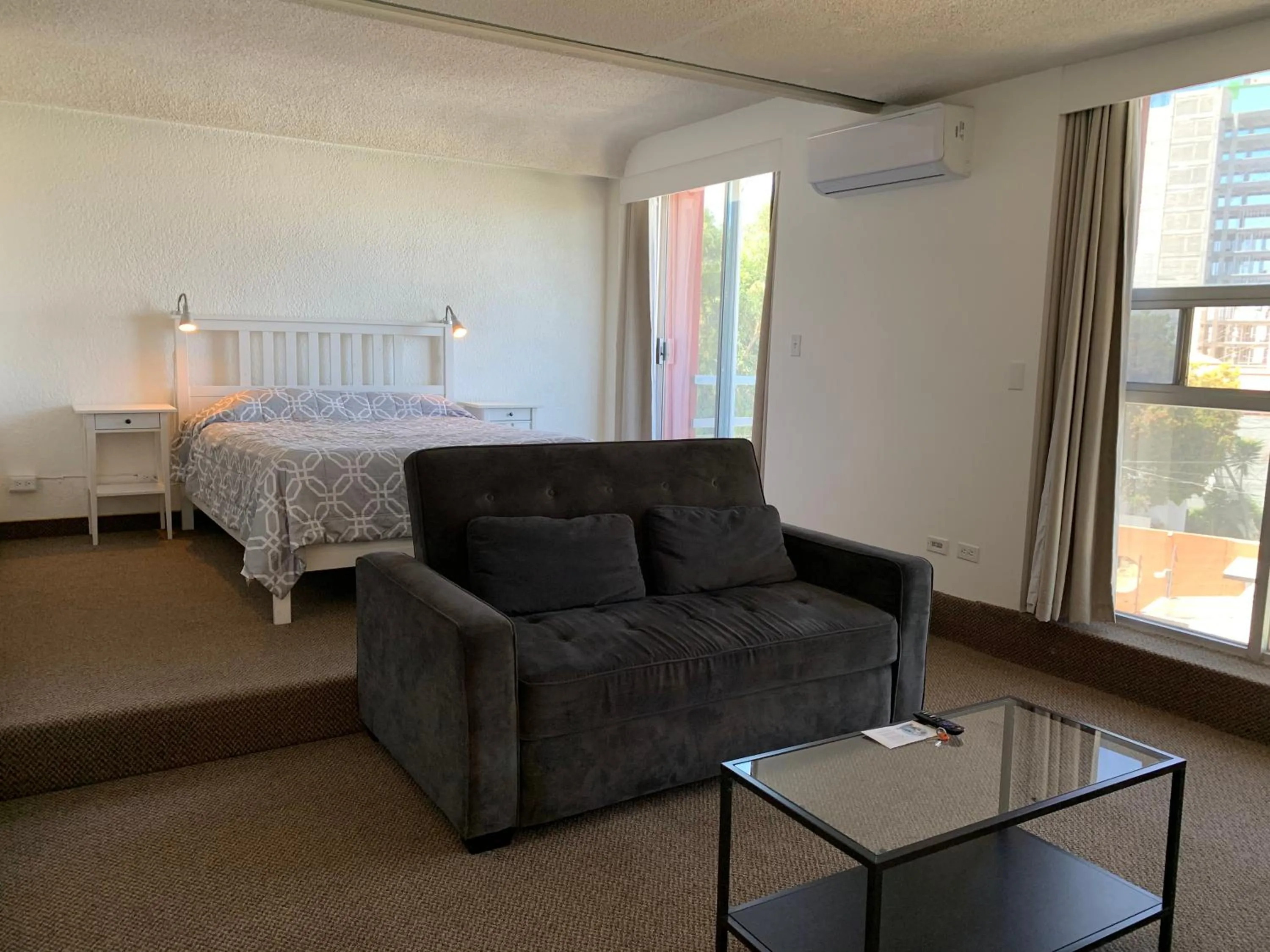 Living room, Bed in Dali Suites -Accommodations in Playas de Tijuana
