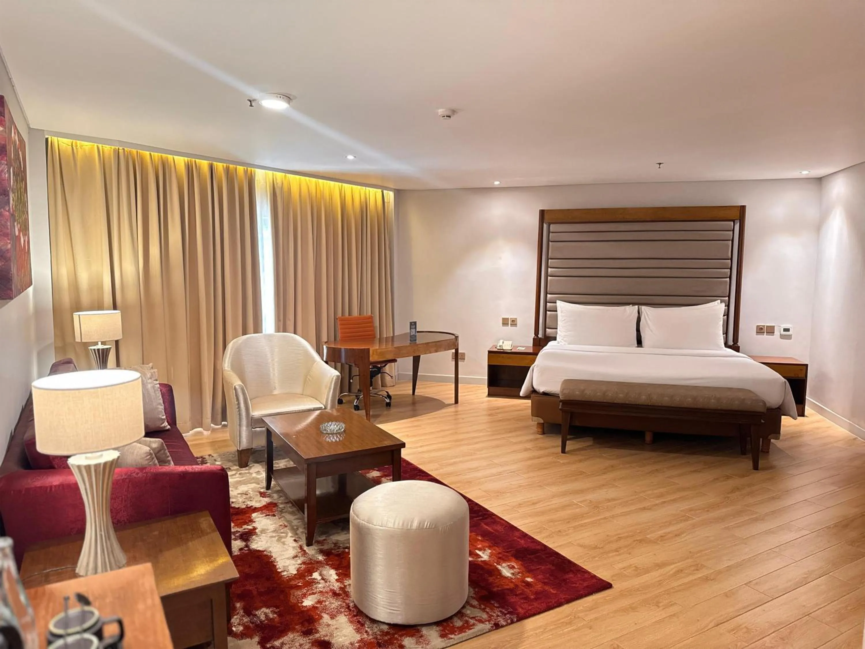 Seating area, Bed in Grand Sahid Jaya