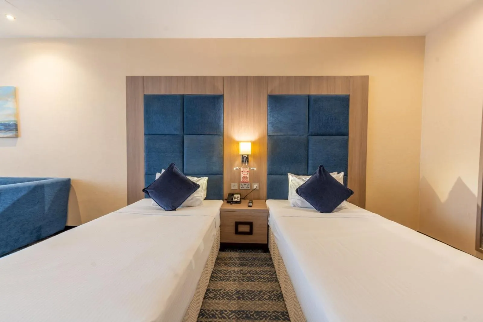 Bed in The CASTLE PREMIUM HOTEL