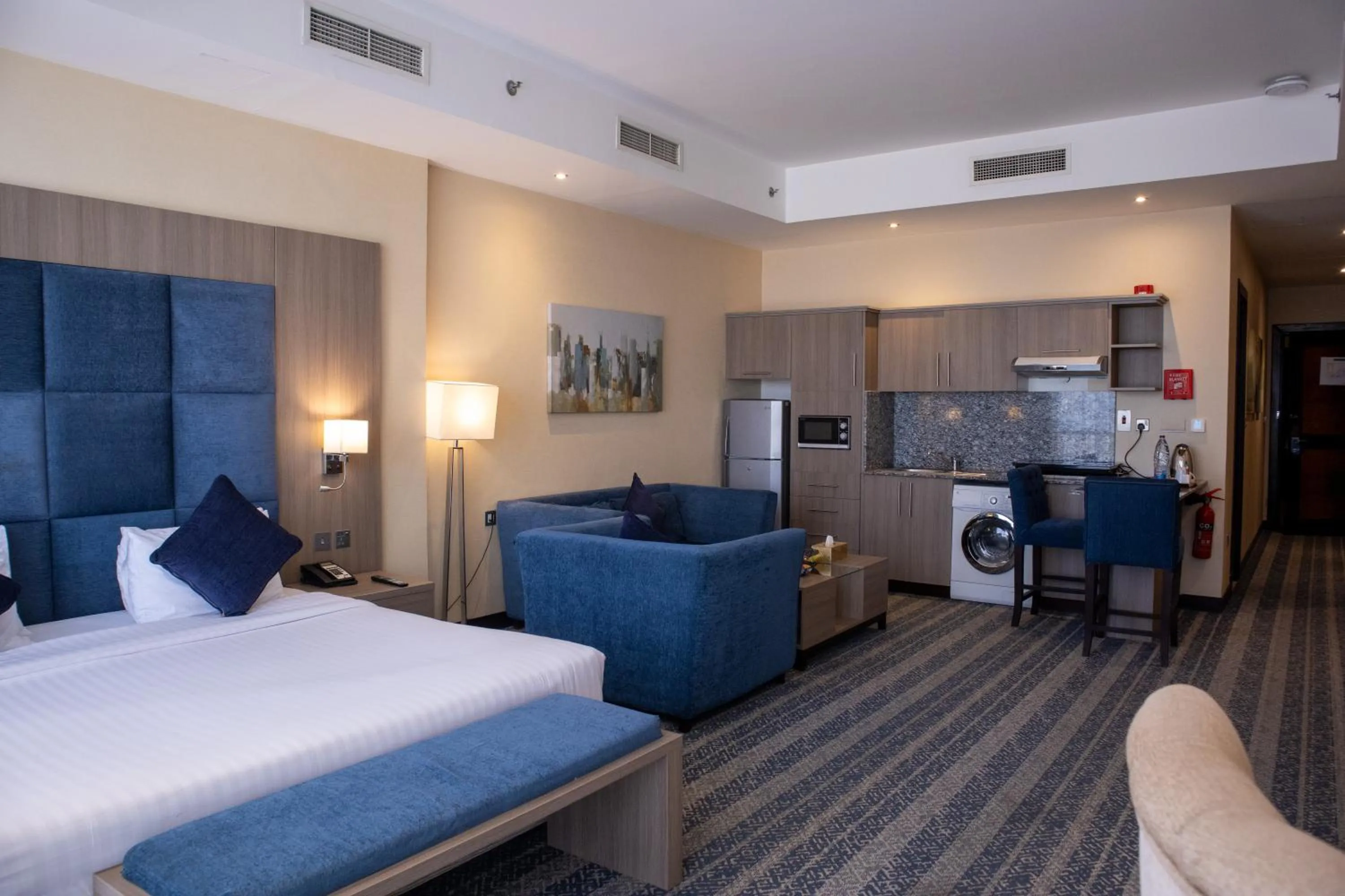 Kitchen or kitchenette, Bed in The CASTLE PREMIUM HOTEL