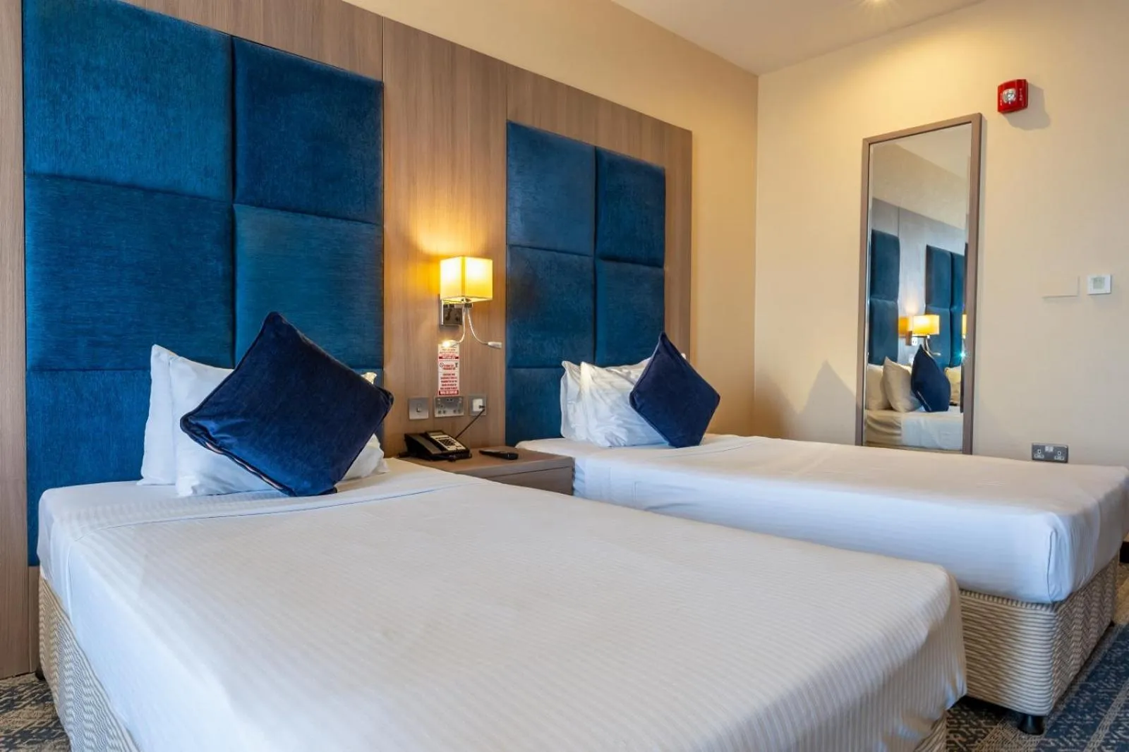 Bed in The CASTLE PREMIUM HOTEL