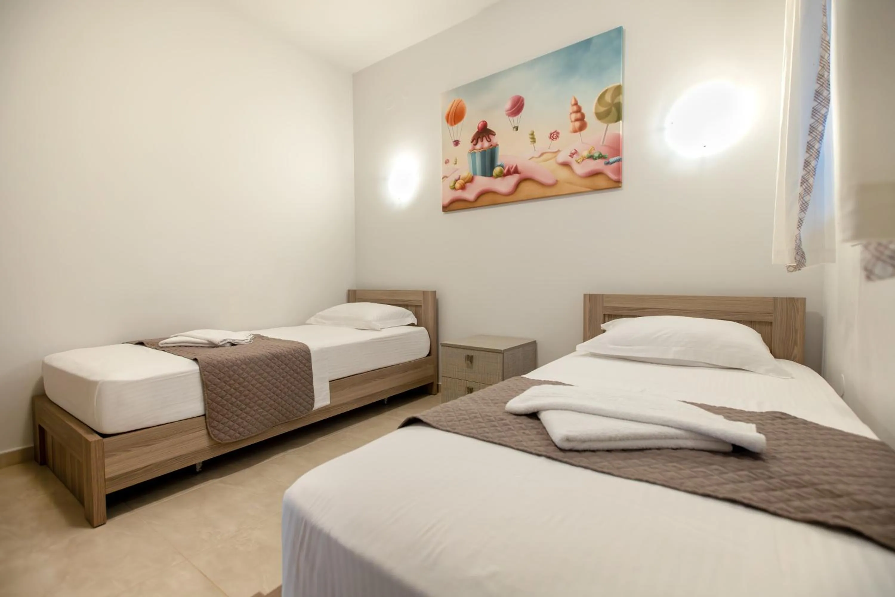 Bed in EllinFos Apartments