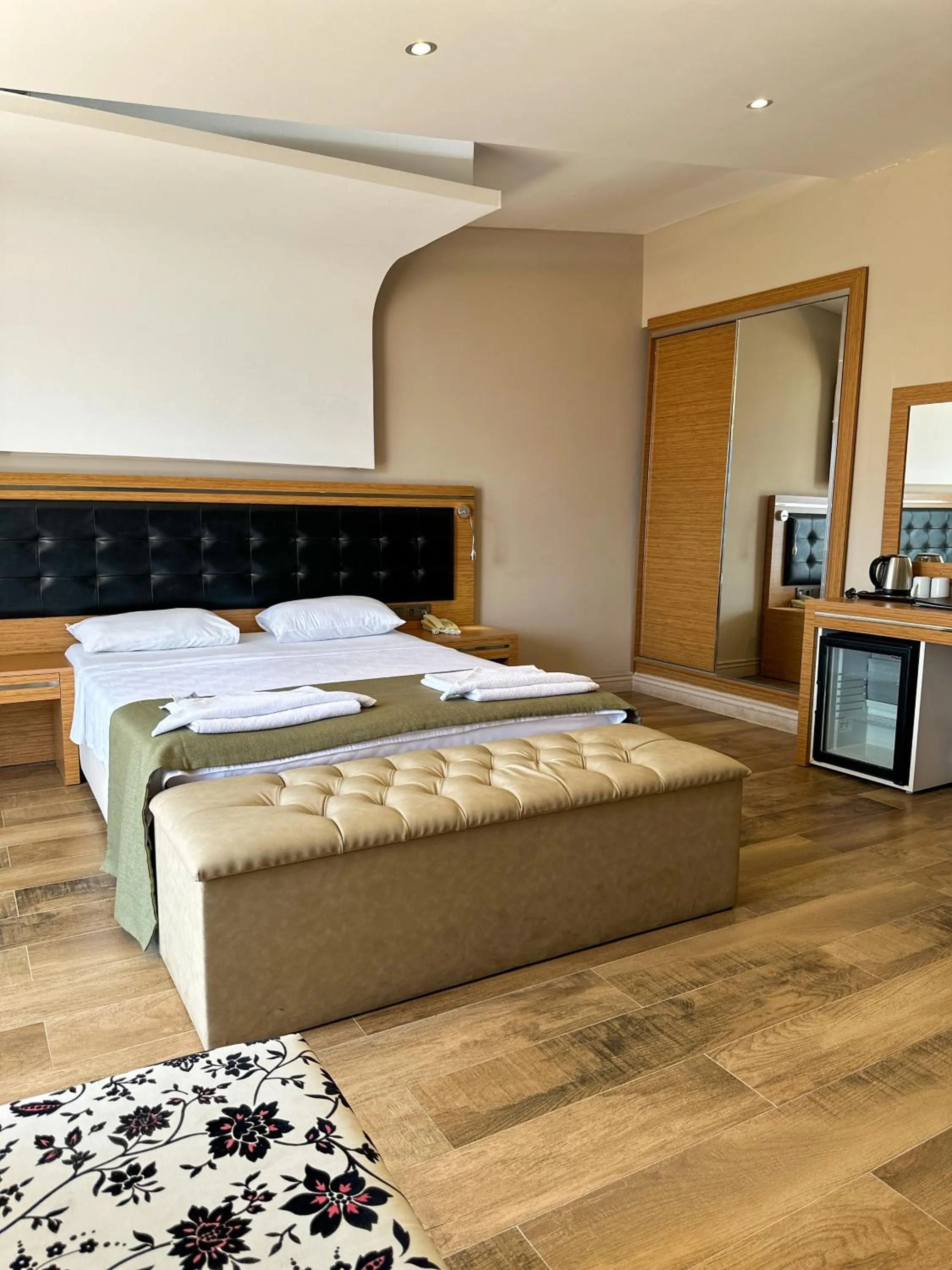 Bed in Aurasia Sea Side Hotel