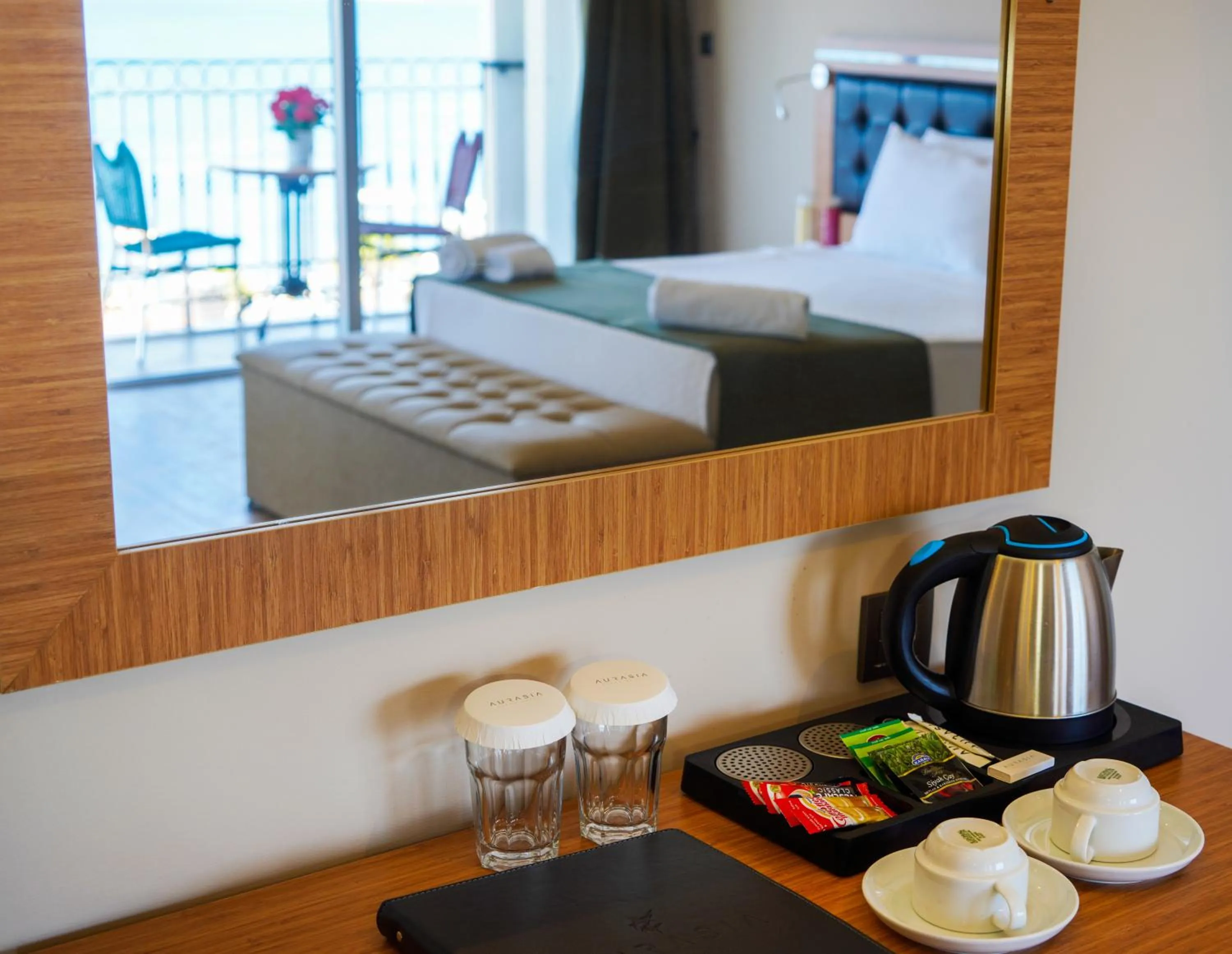 Kitchen or kitchenette, Bed in Aurasia Sea Side Hotel