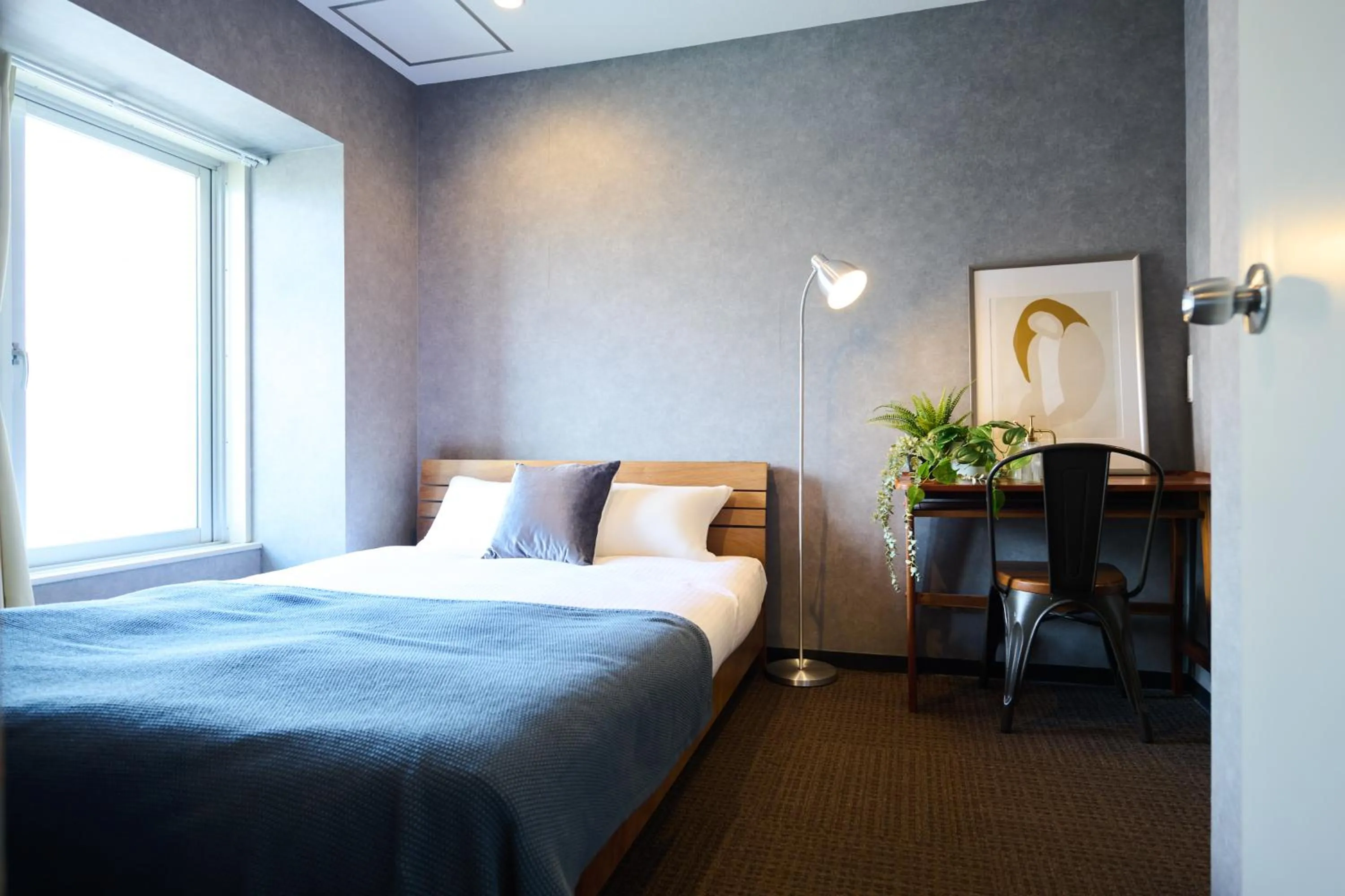 Bed in Residence Hotel Stripe Sapporo