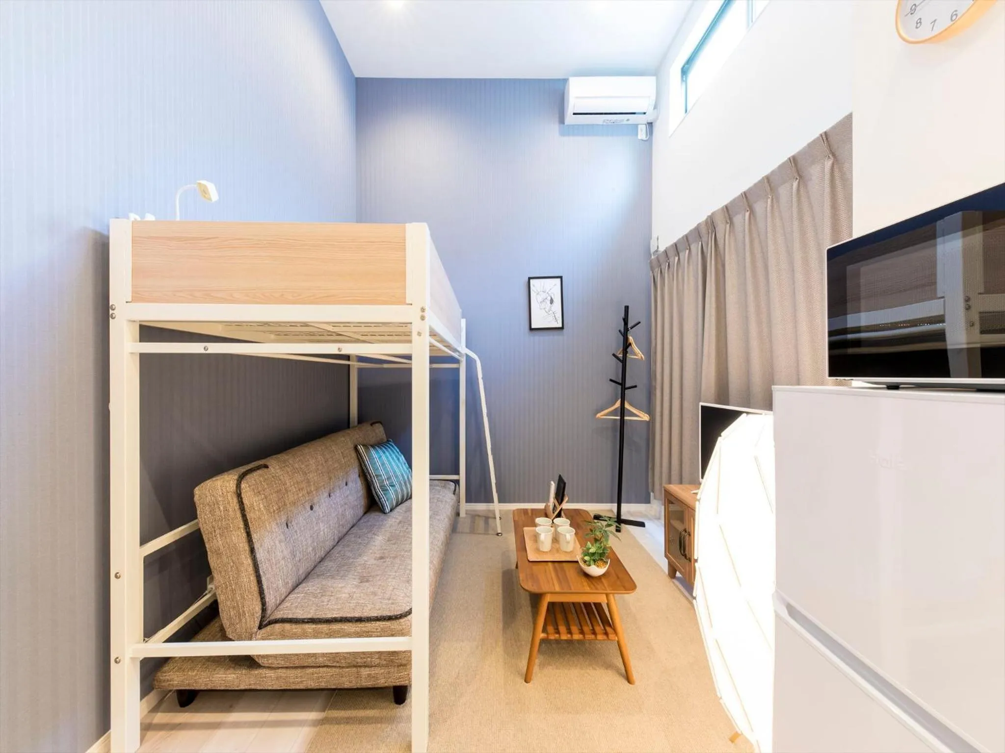 Living room, Bed in TRIP POD SUMIYOSHI B