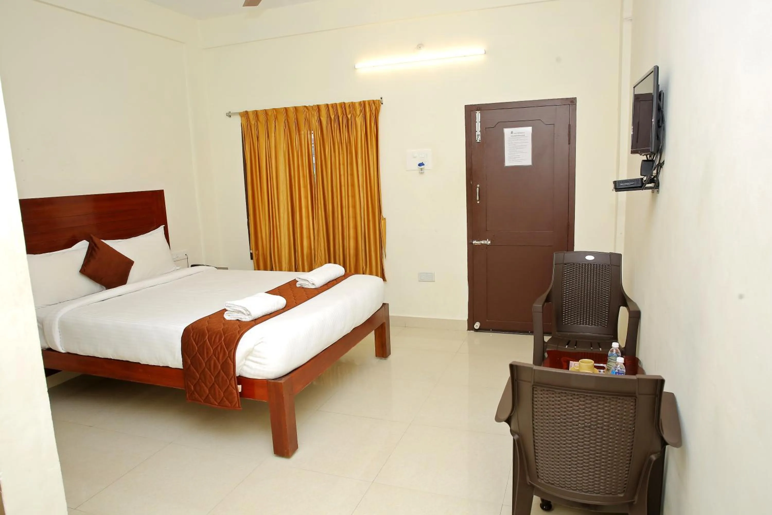 Photo of the whole room, Bed in Rani Residency