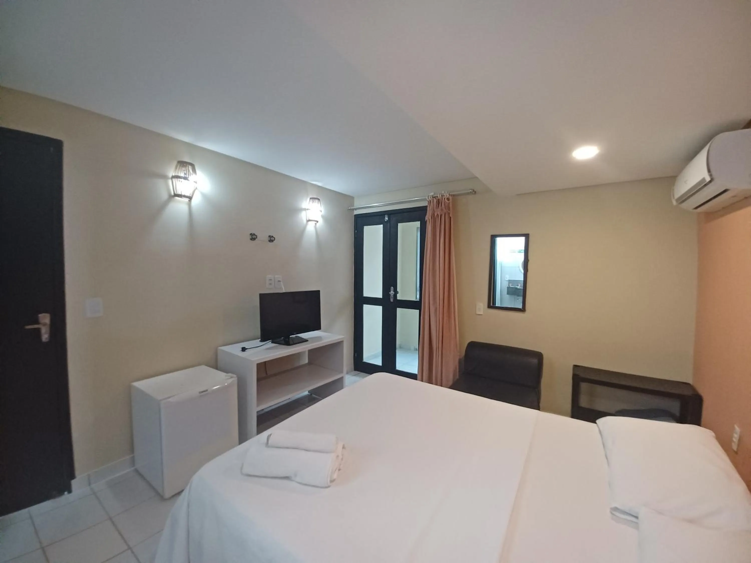 Bed in Pousada Laguna