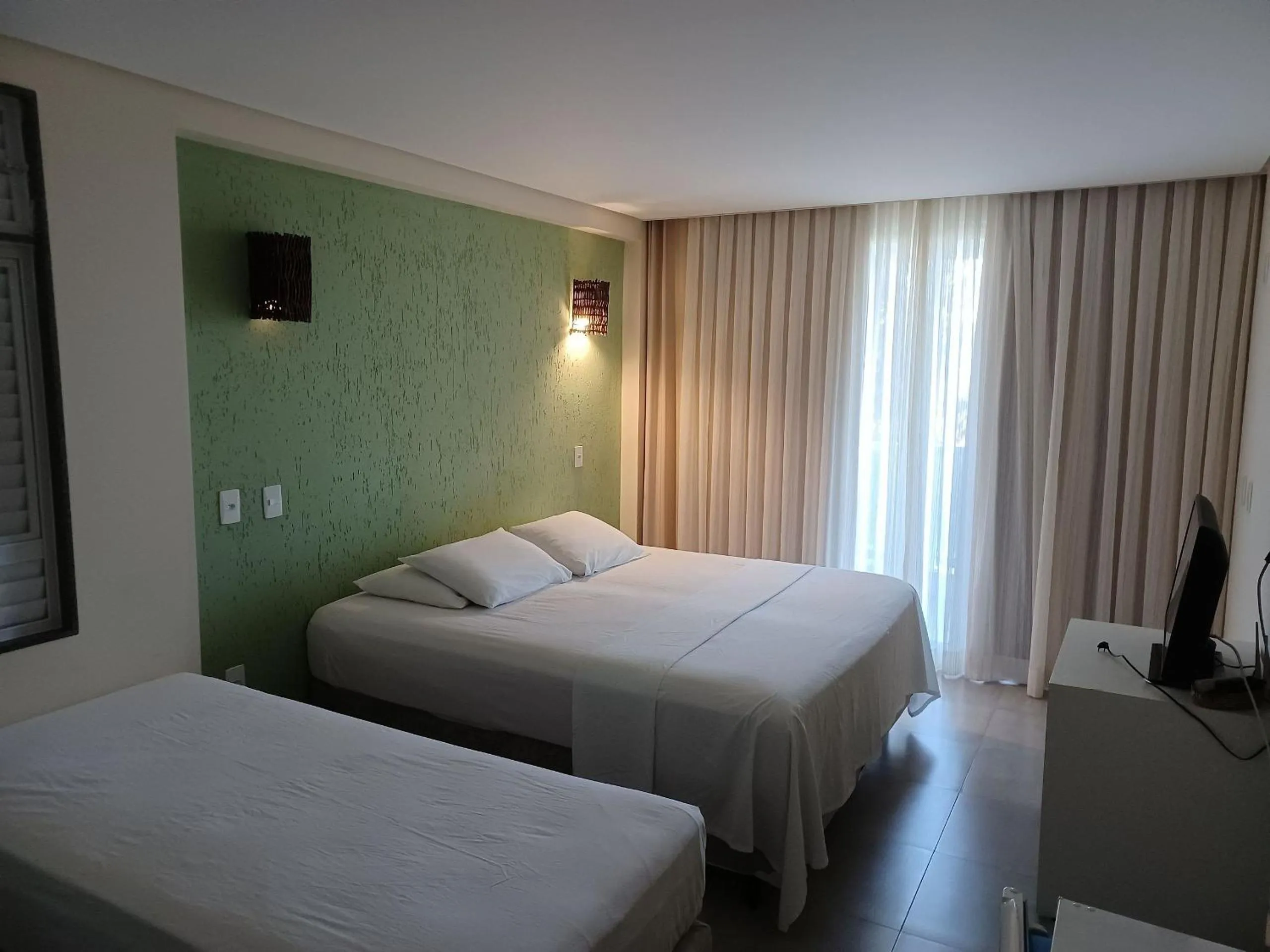 Bed in Pousada Laguna