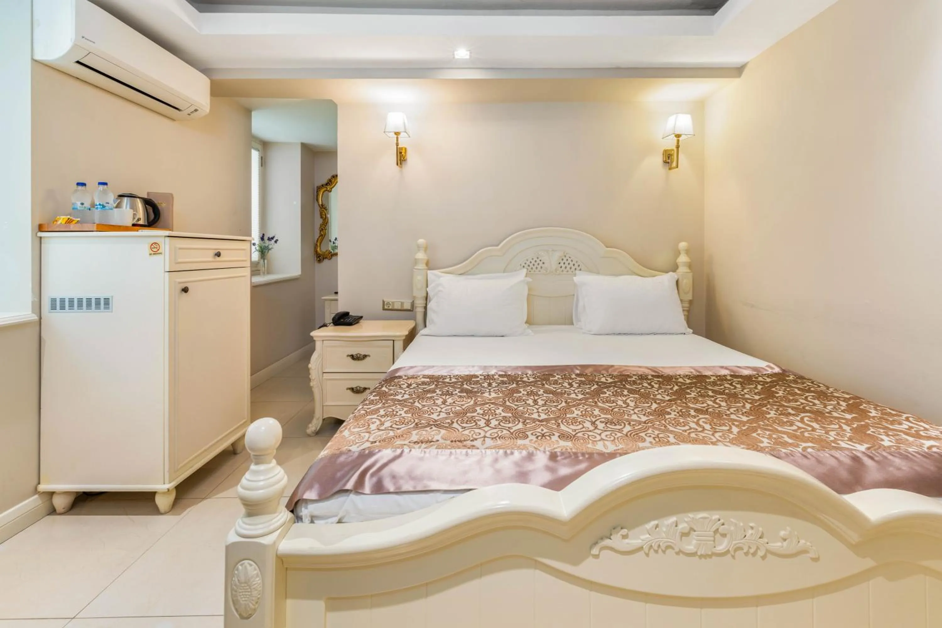 Bed in Elegance East Hotel