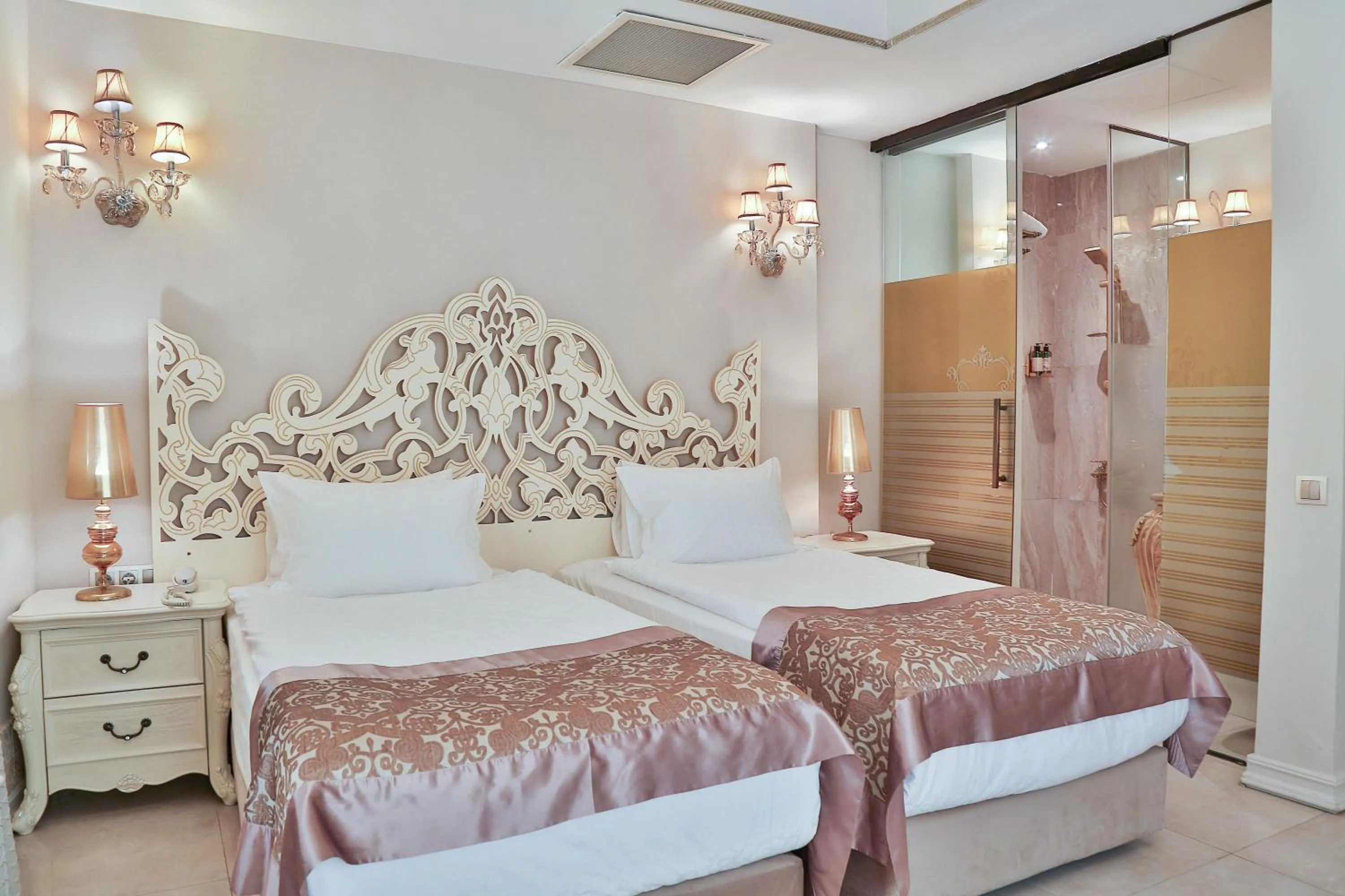 Bed in Elegance East Hotel