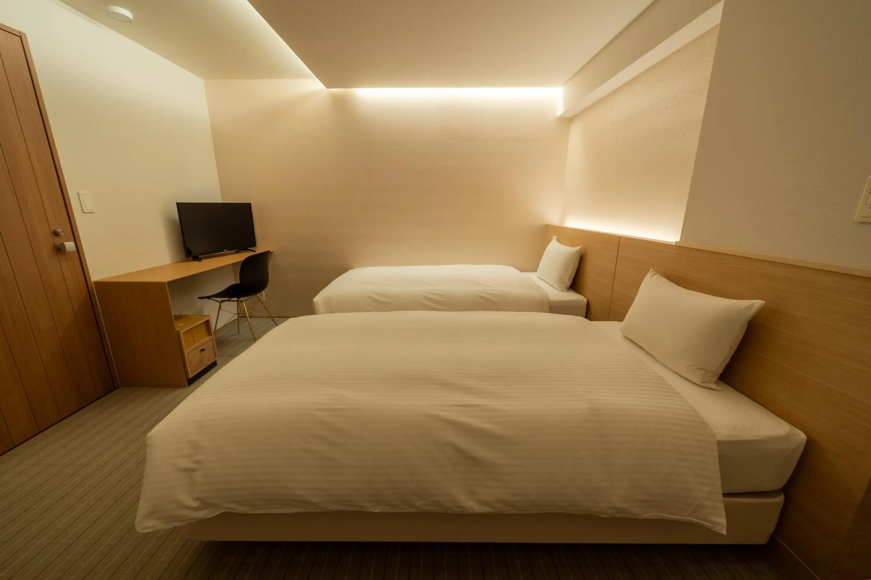 Bed in RESI STAY Hachi Inn