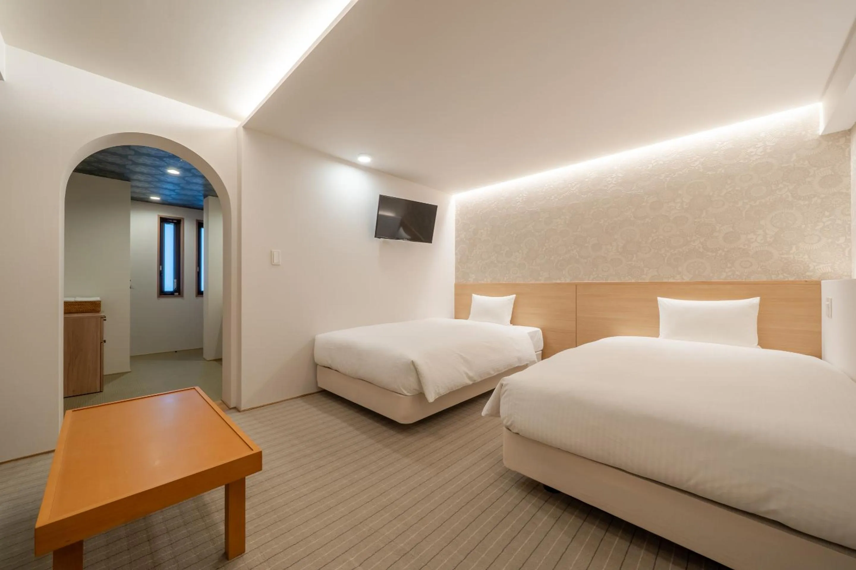 Bed in RESI STAY Hachi Inn