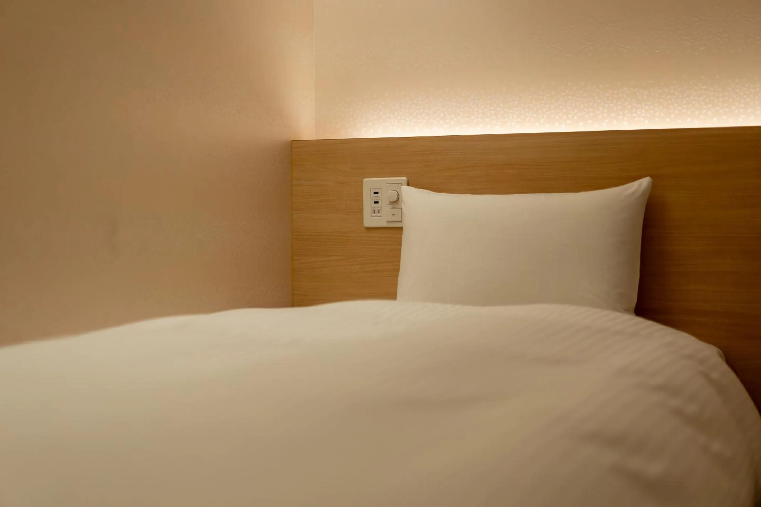 Bed in RESI STAY Hachi Inn