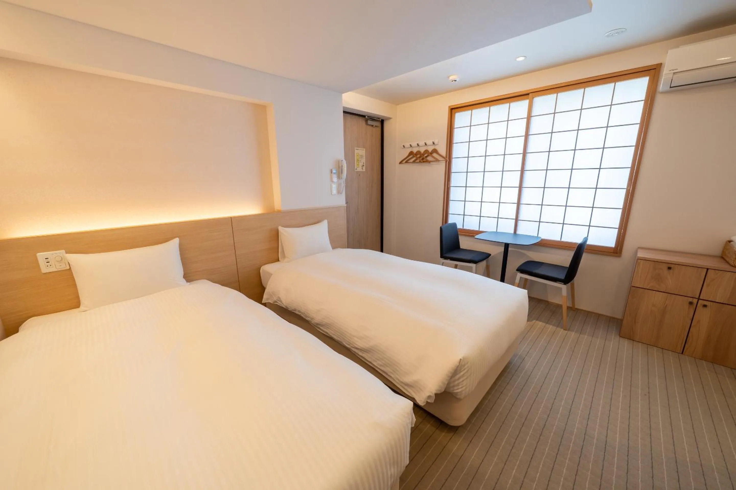 Bed in RESI STAY Hachi Inn