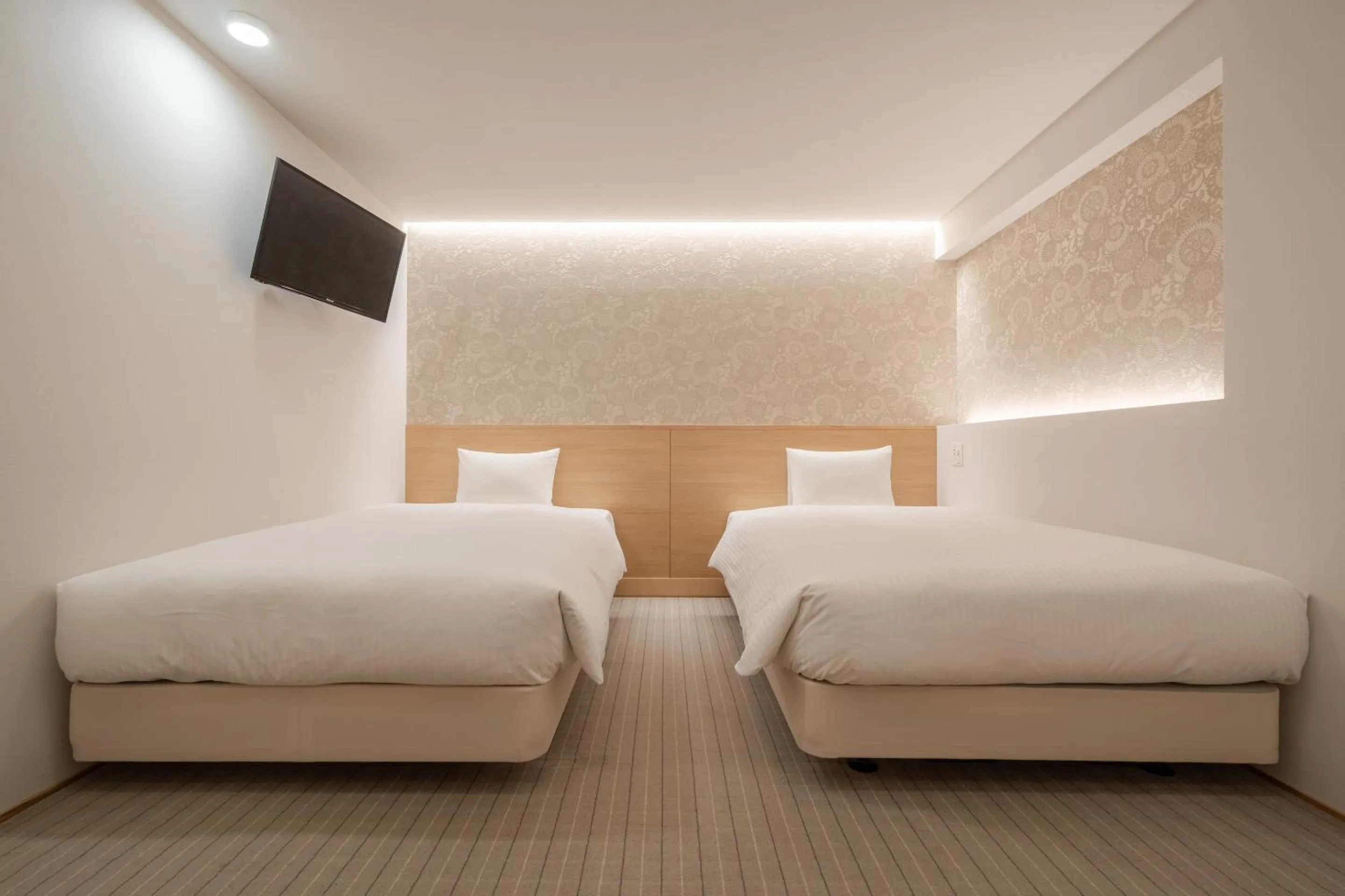 Bed in RESI STAY Hachi Inn