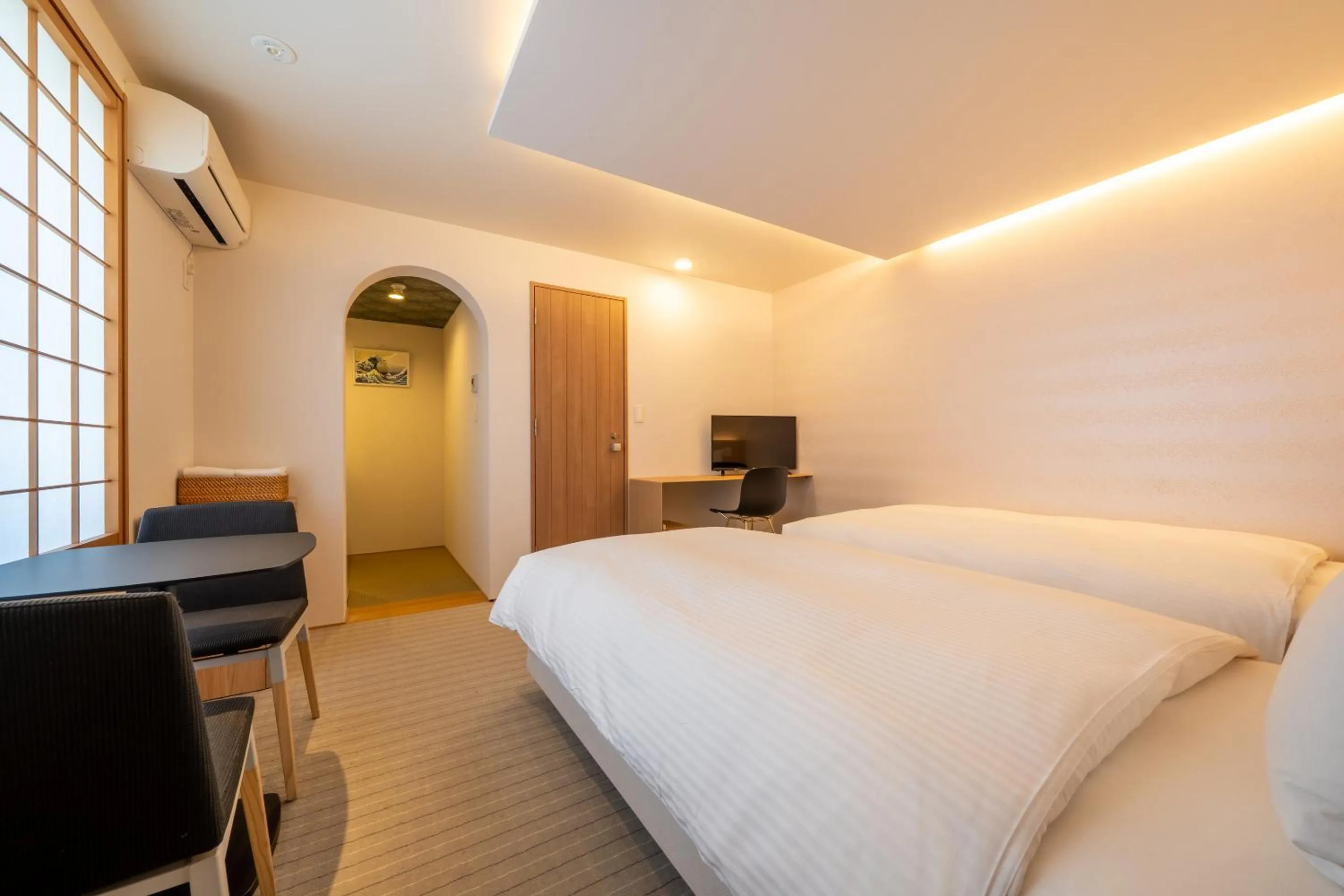 Bed in RESI STAY Hachi Inn