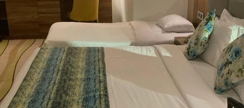 Bed in Jacob's Garden Hotel