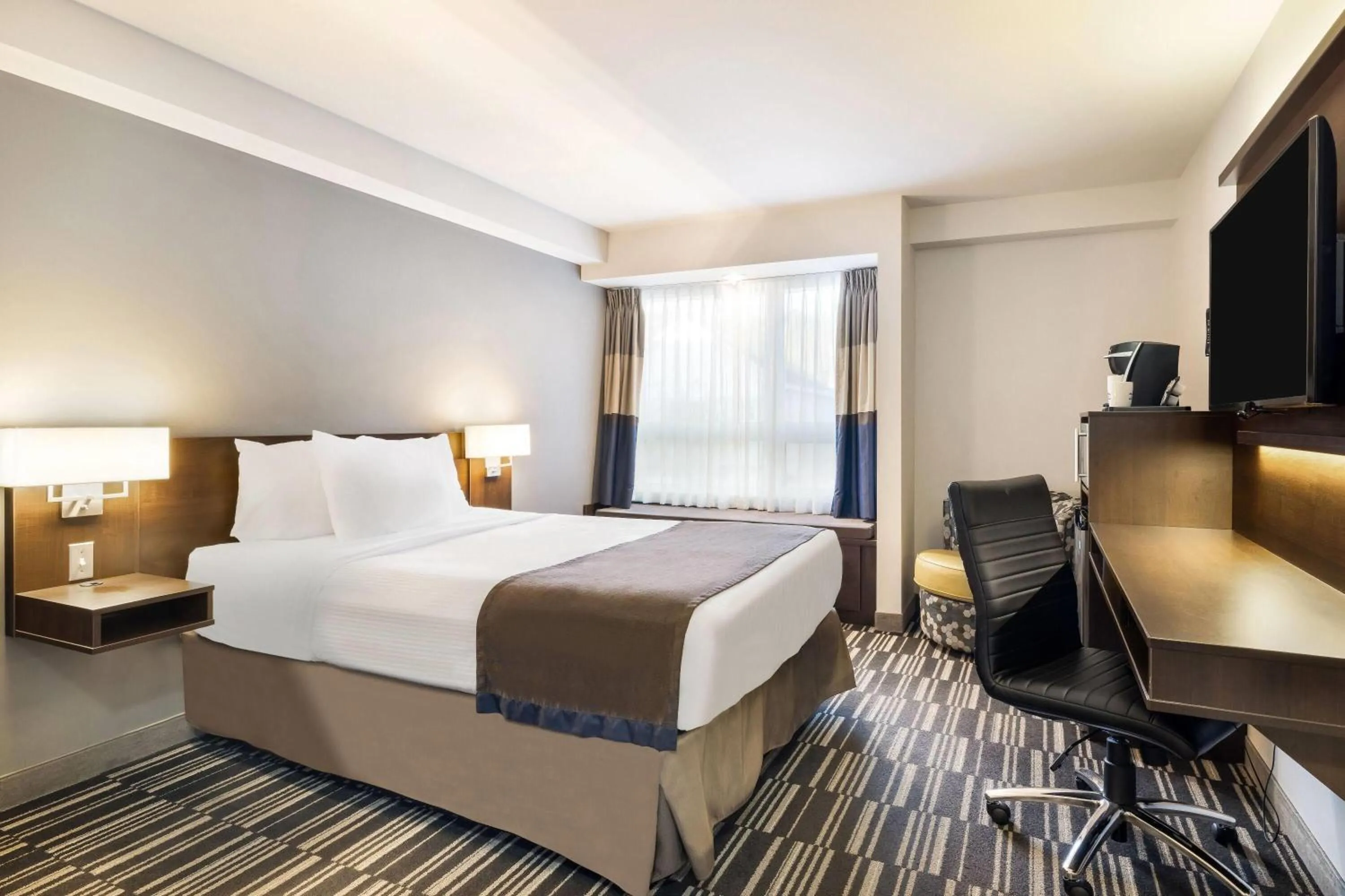 Bed in Microtel Inn & Suites by Wyndham Mont Tremblant