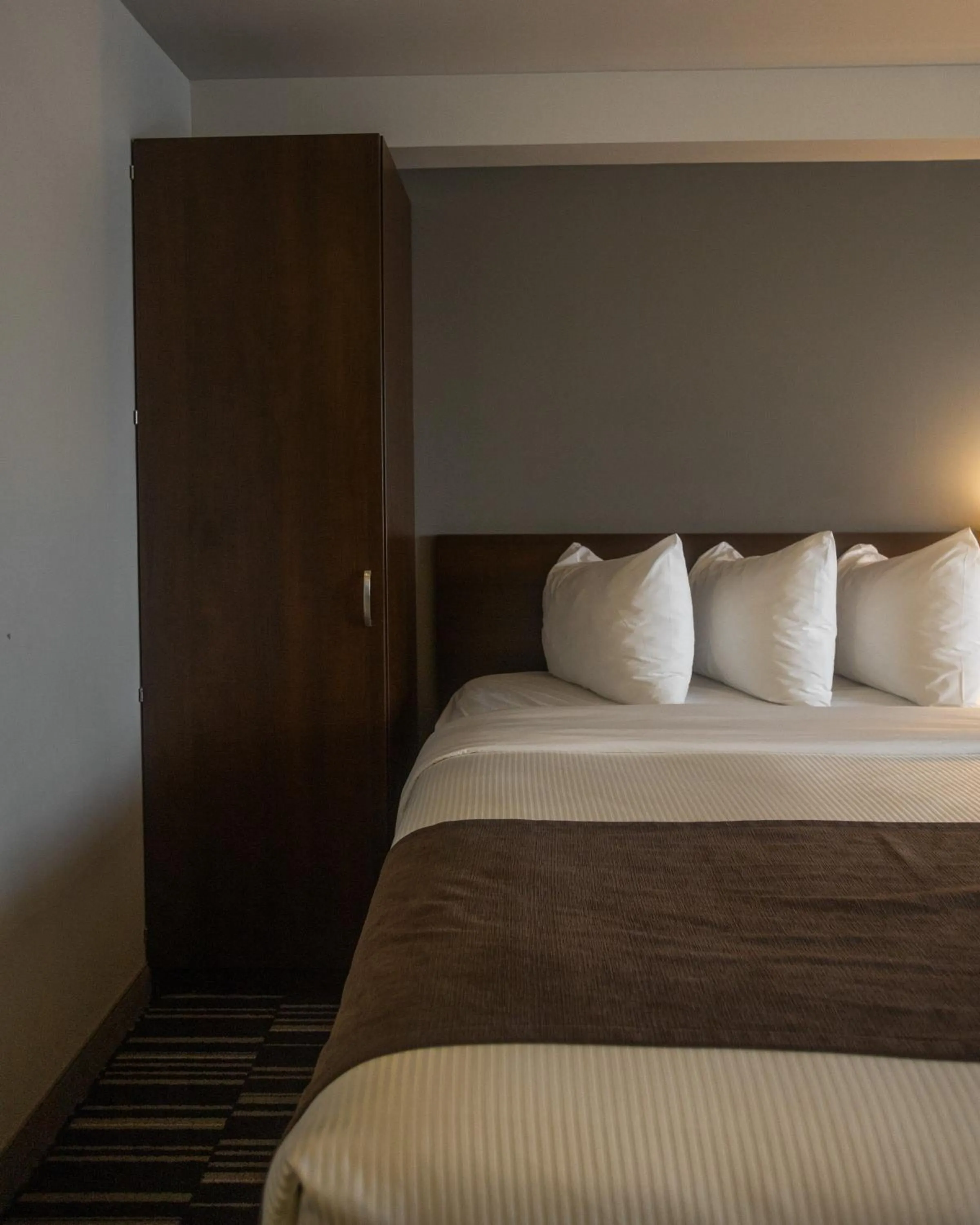 Bed in Microtel Inn & Suites by Wyndham Mont Tremblant