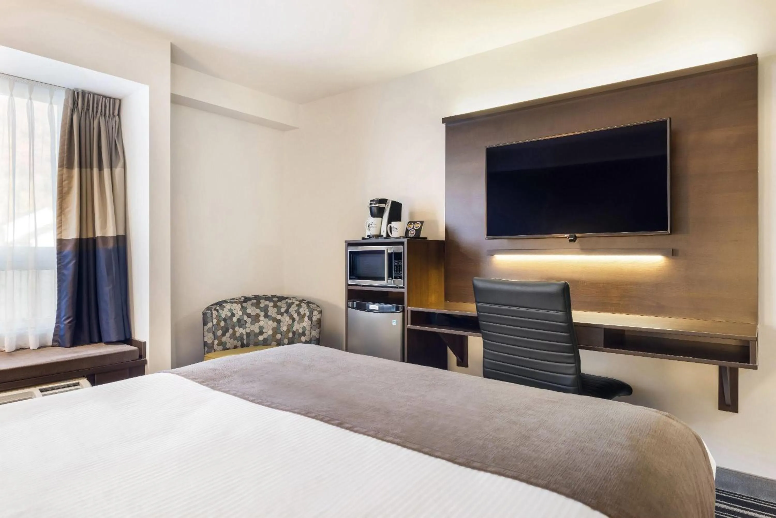 Bed in Microtel Inn & Suites by Wyndham Mont Tremblant