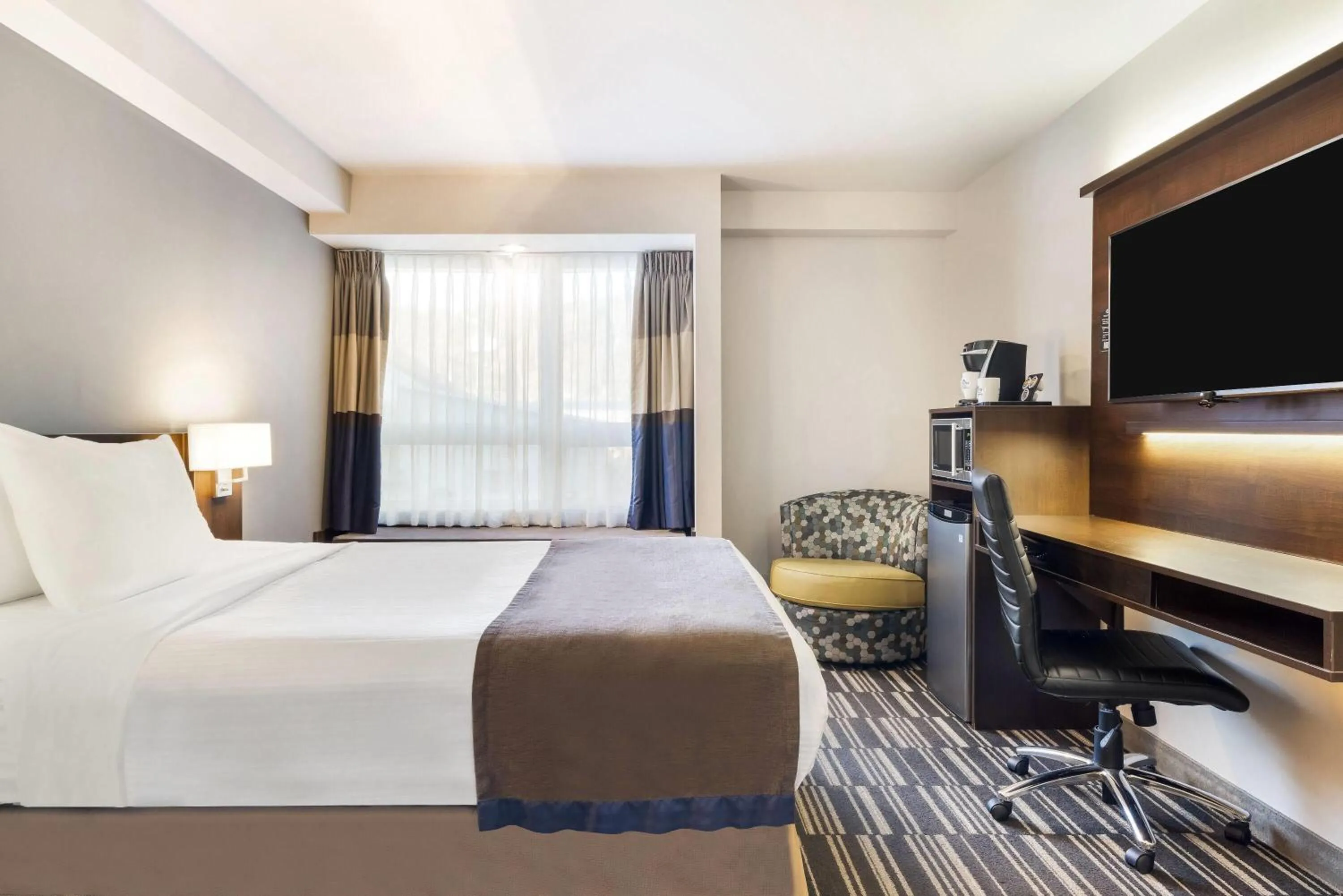 Bed in Microtel Inn & Suites by Wyndham Mont Tremblant