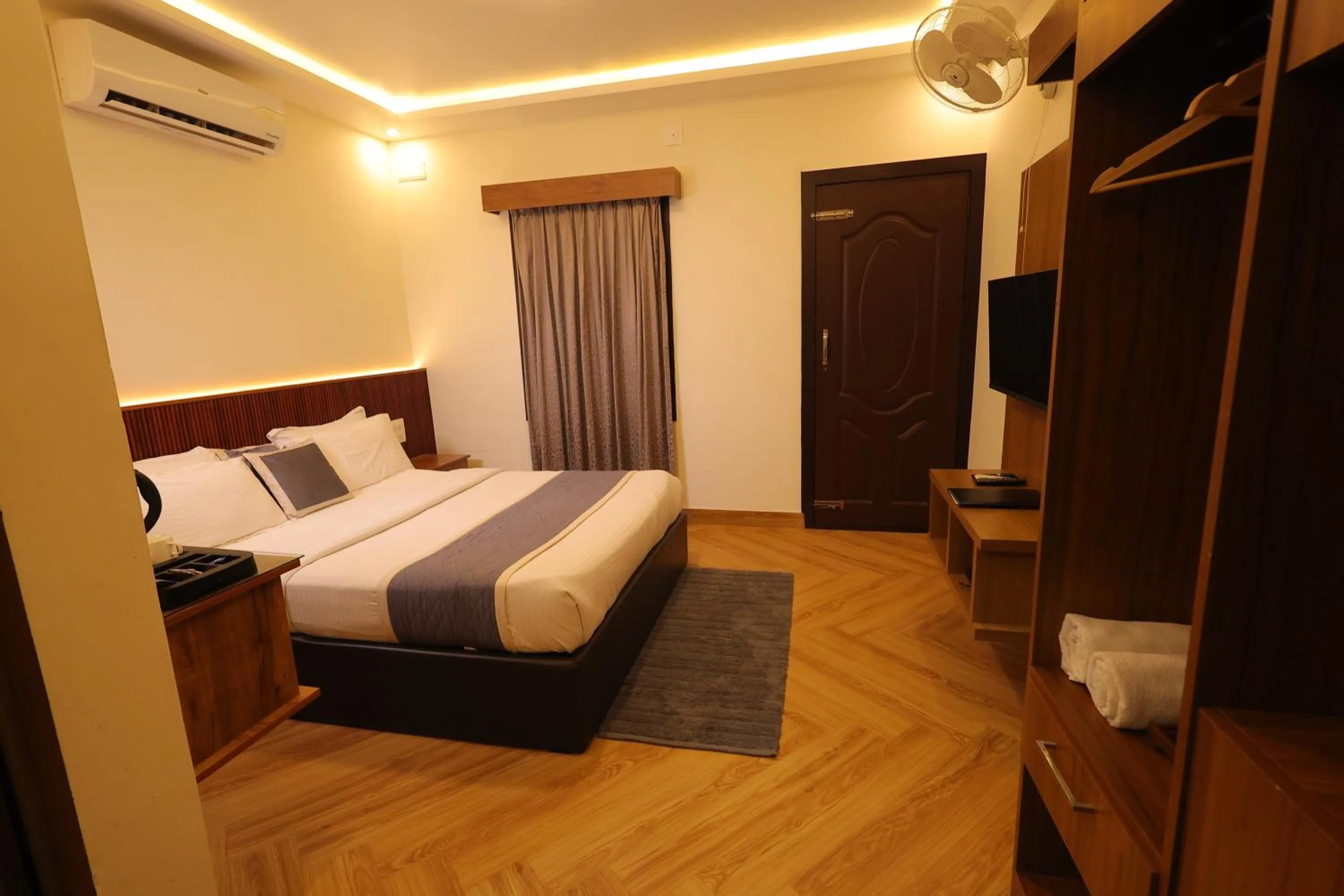 wardrobe, Bed in Le Eden Premium Wayanad Pool Resort