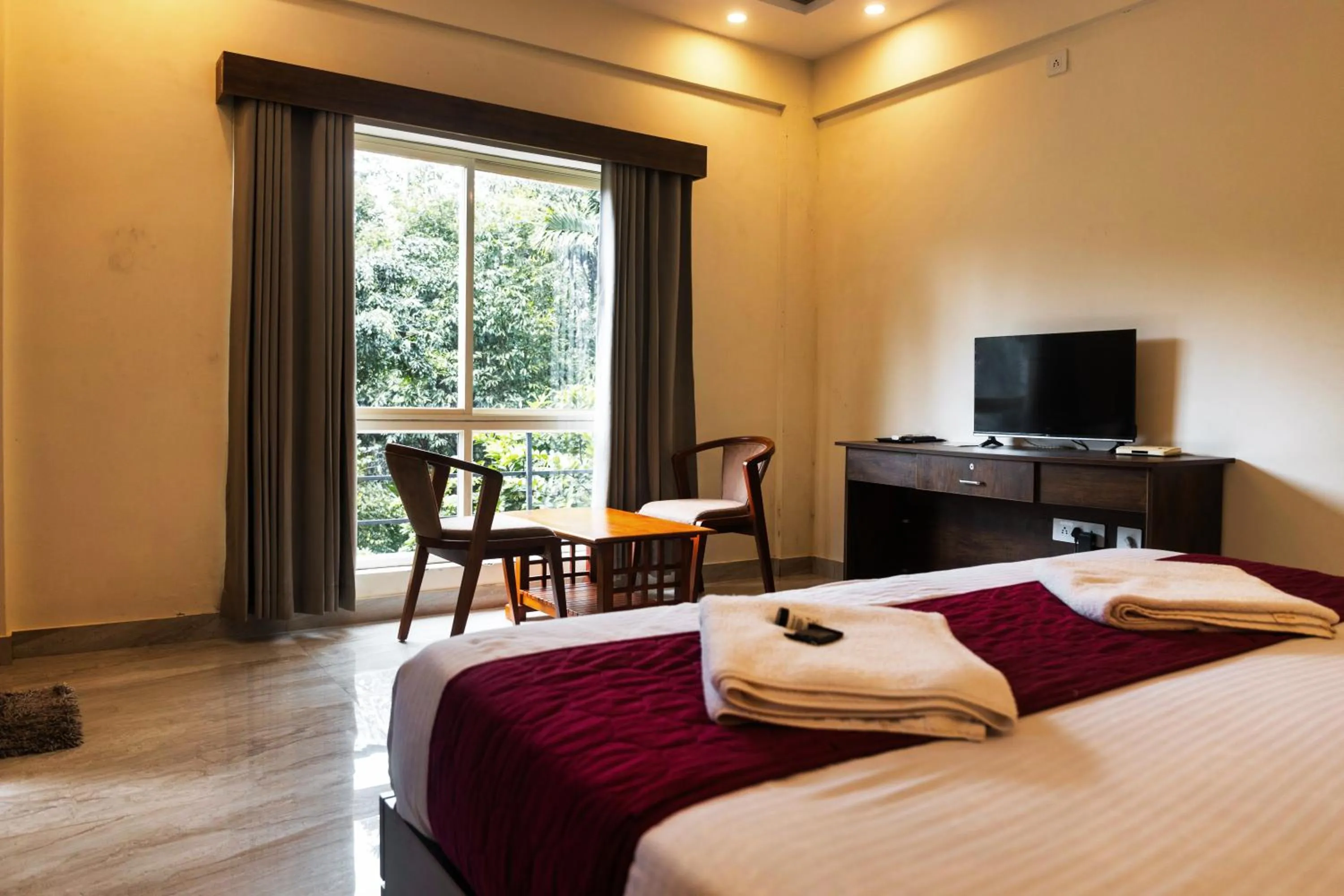 Bed in Le Eden Premium Wayanad Pool Resort