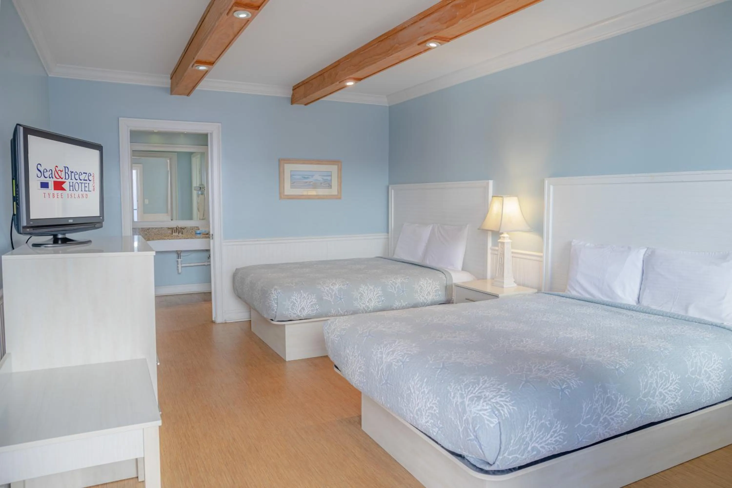 Photo of the whole room, Bed in Sea and Breeze Hotel and Condo