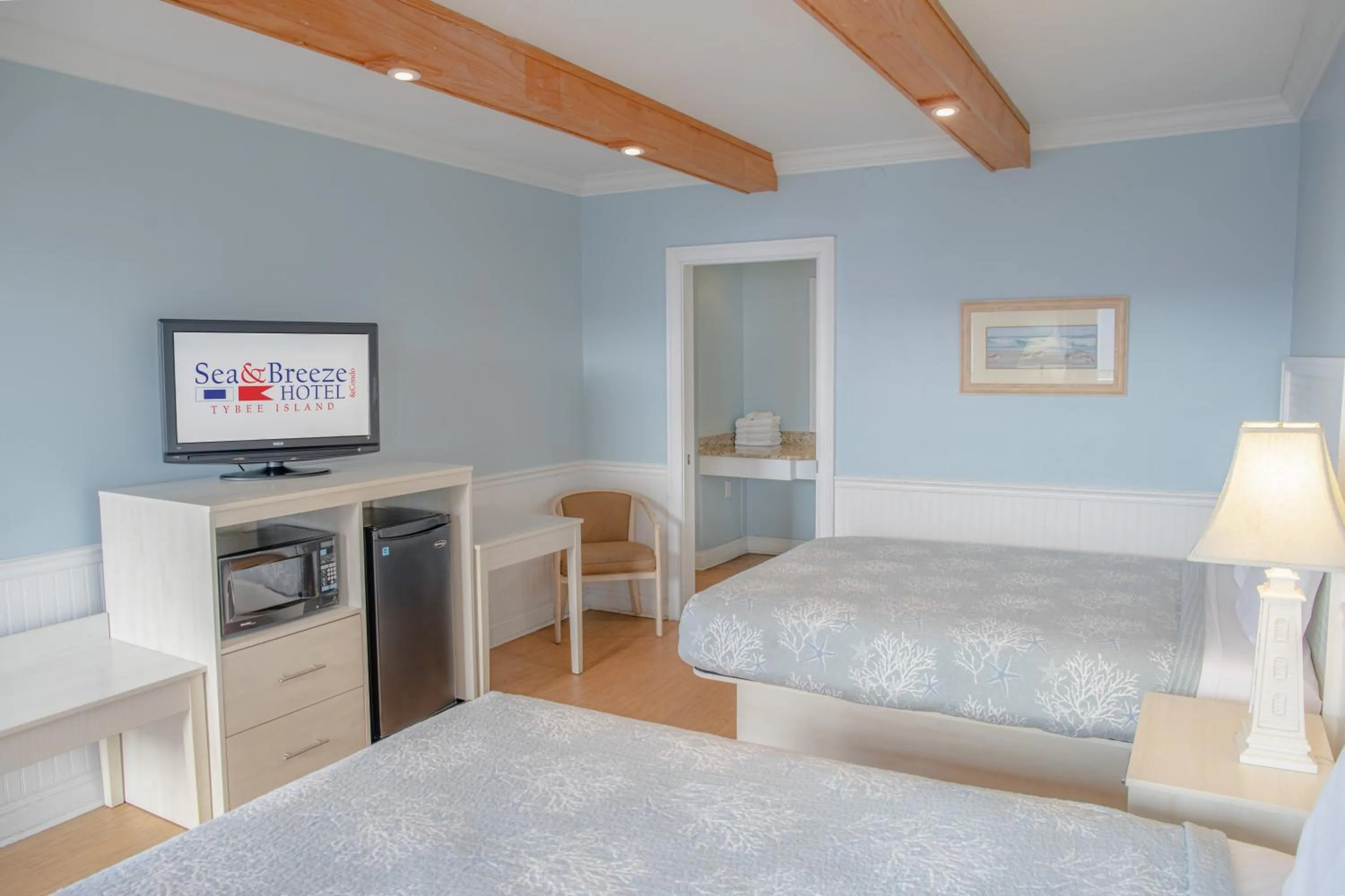 Bed in Sea and Breeze Hotel and Condo