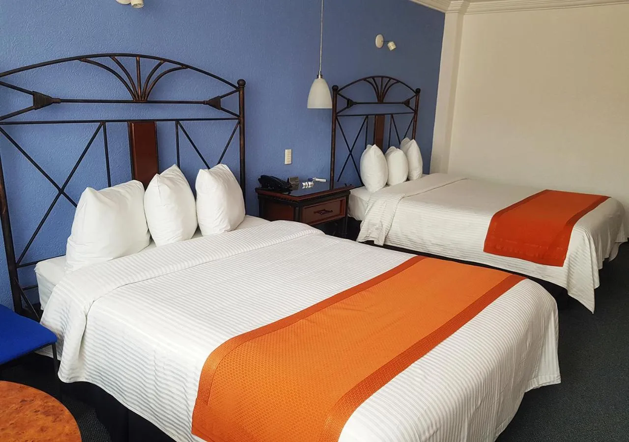 Bed in Hotel Ciros