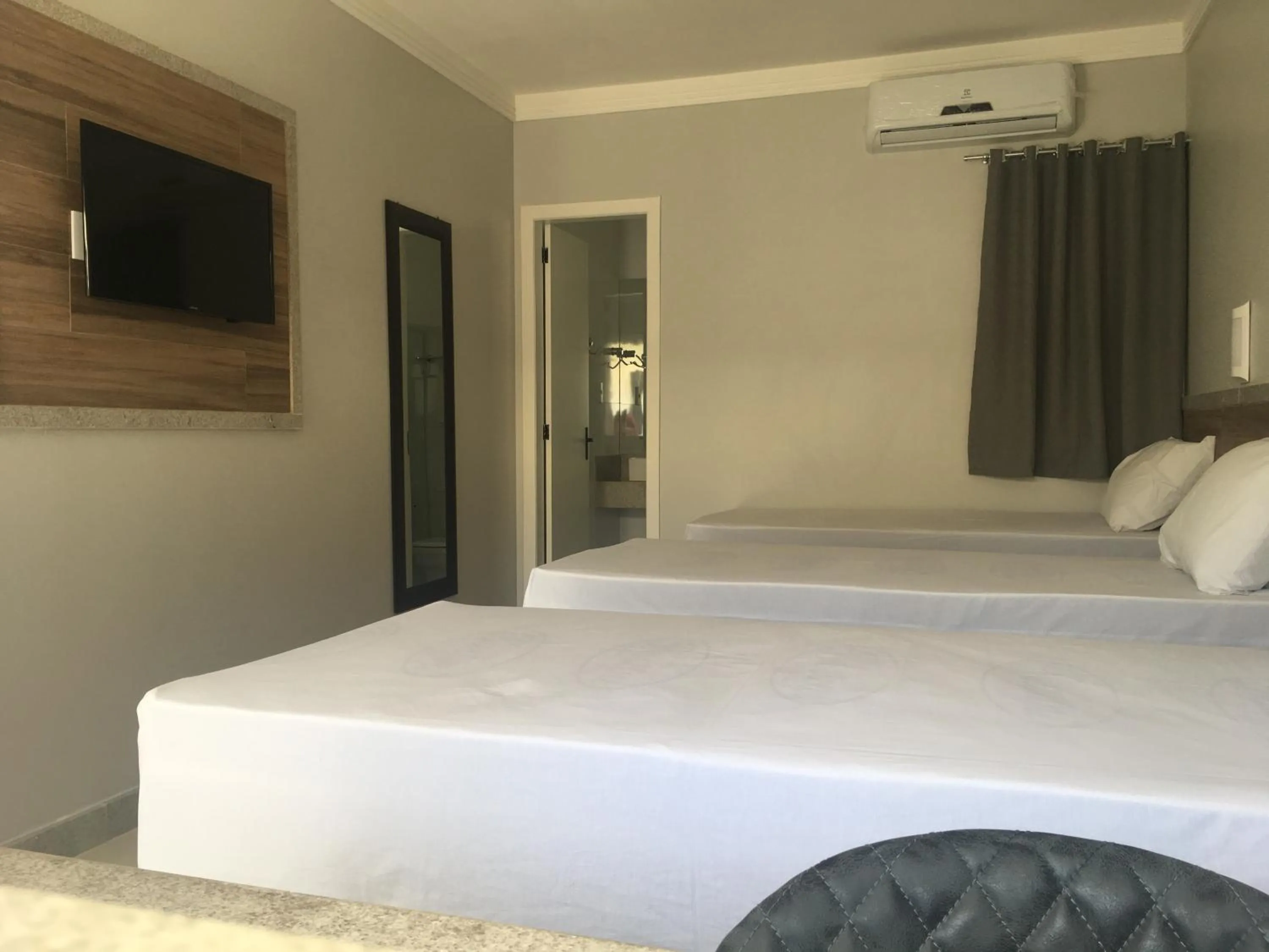 Bed in Tropical Mar Hotel