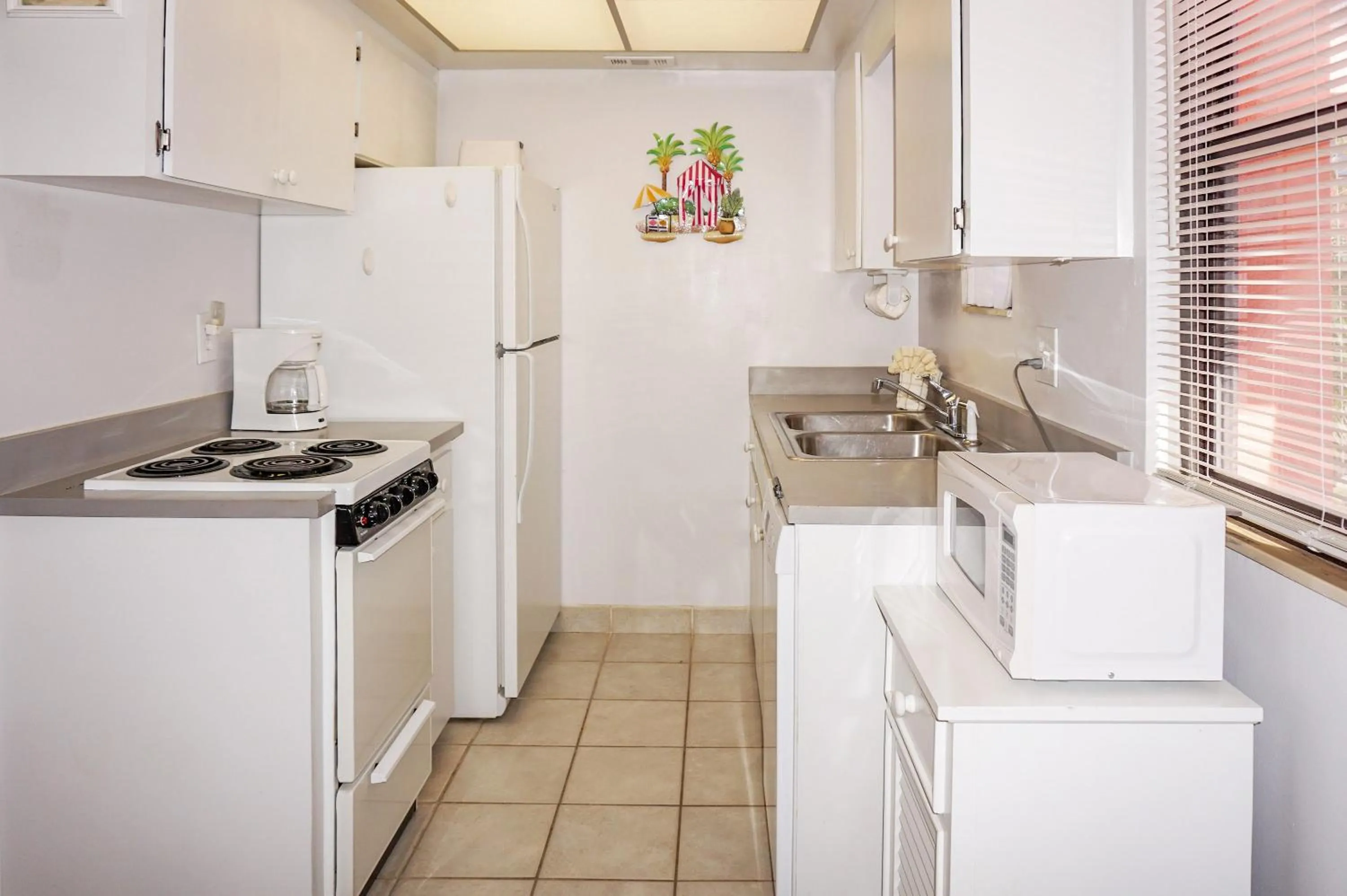 Kitchen or kitchenette in Gulf Winds Resort by Travel Resort Services