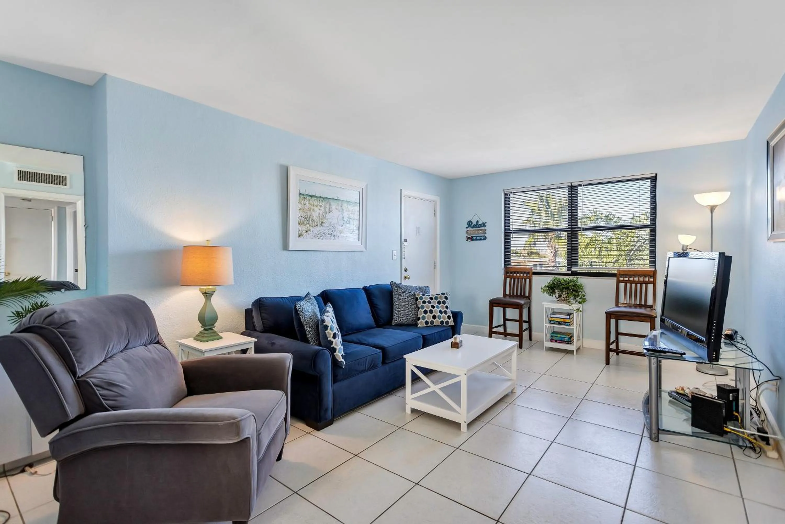 Living room in Gulf Winds Resort by Travel Resort Services