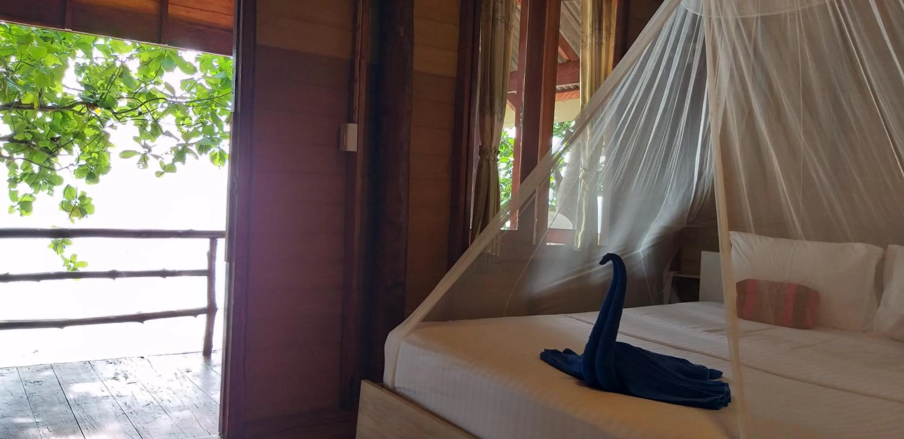 Bed in Jungle Hill Beach Bungalow
