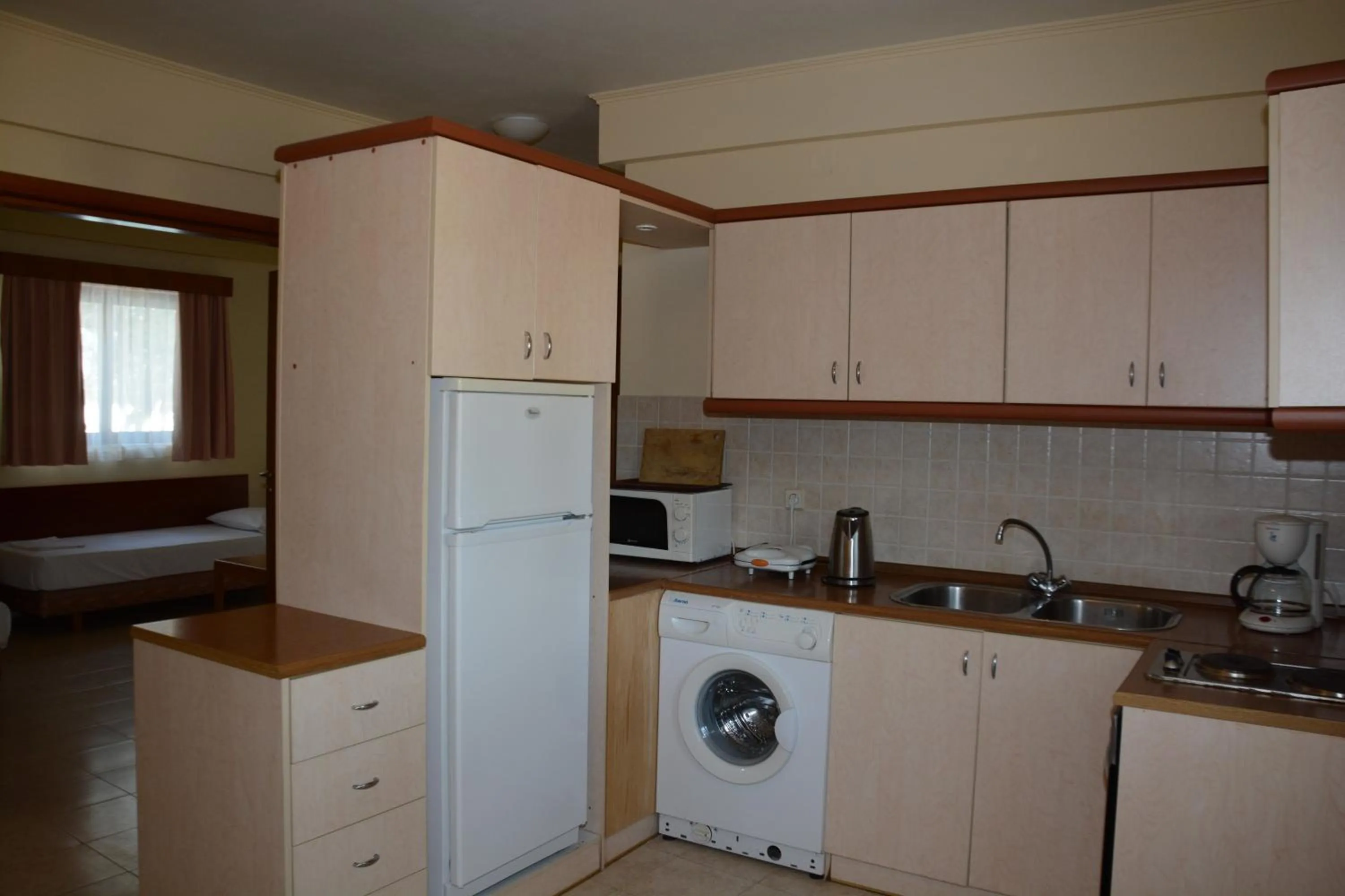 Kitchen or kitchenette in Niki Hotel Apartments