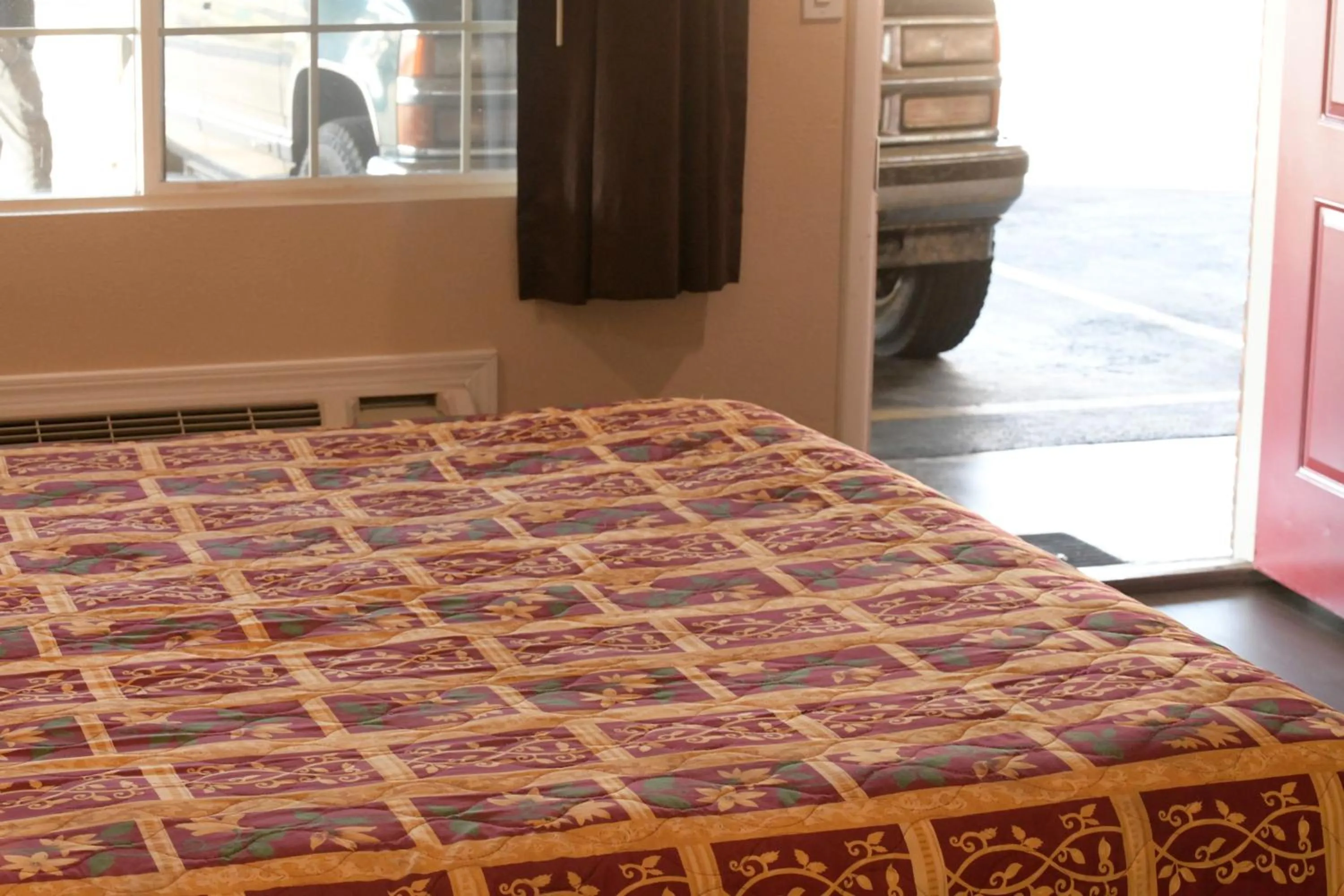 Bed in A-1 Budget Motel