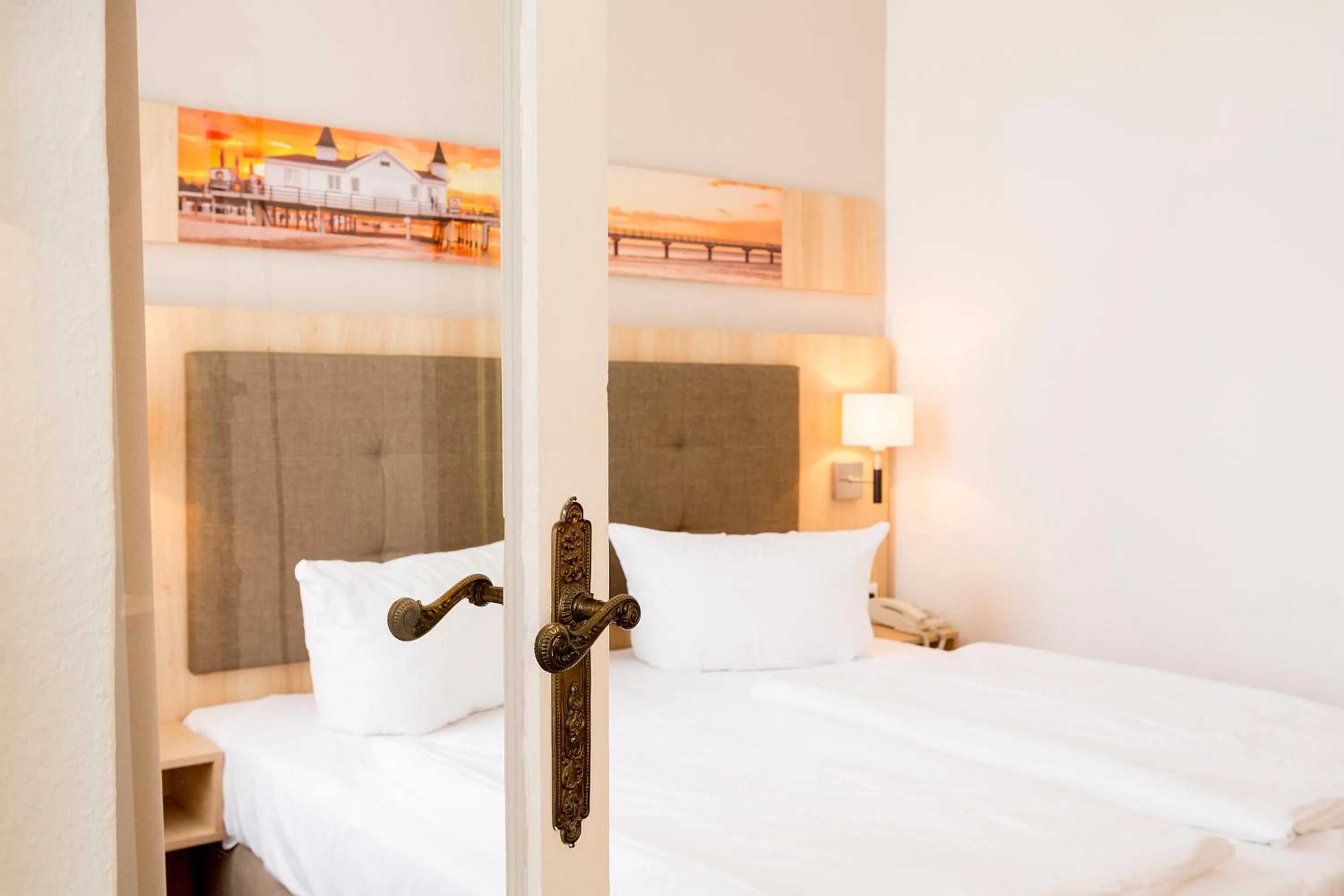 Bed in Garni Eden Hotels