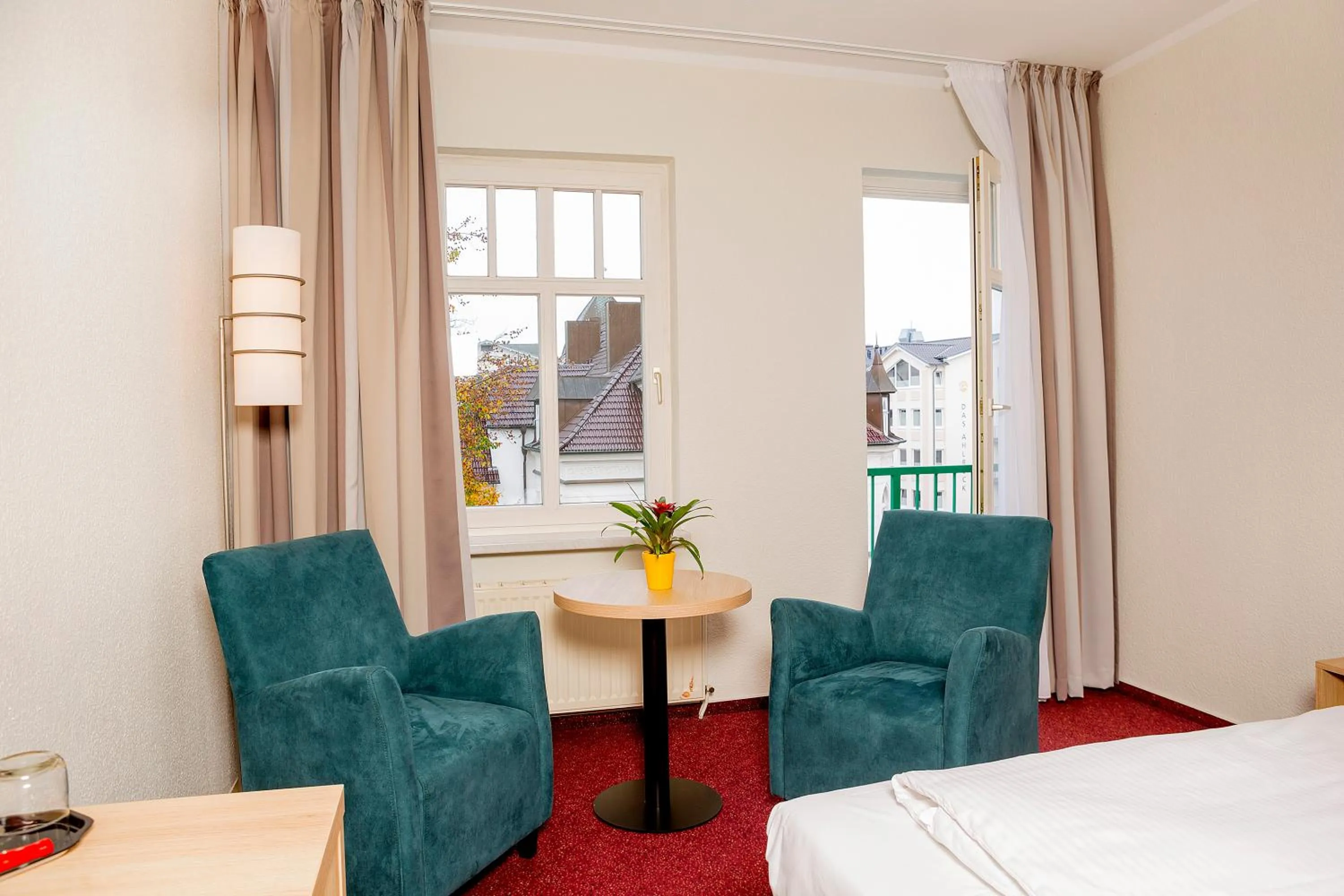 Seating area, Bed in Garni Eden Hotels