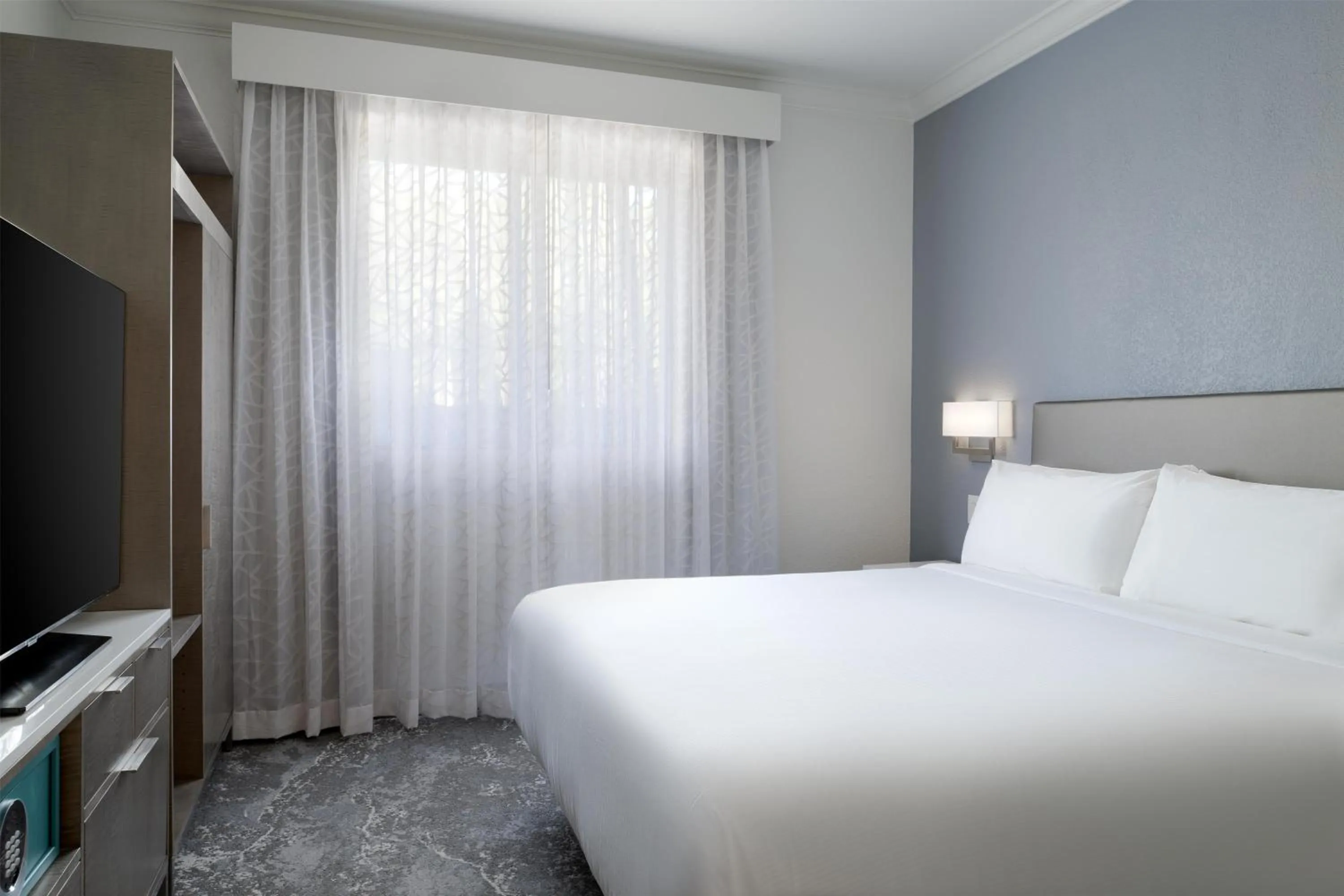 Bed in Hilton Boca Raton Suites