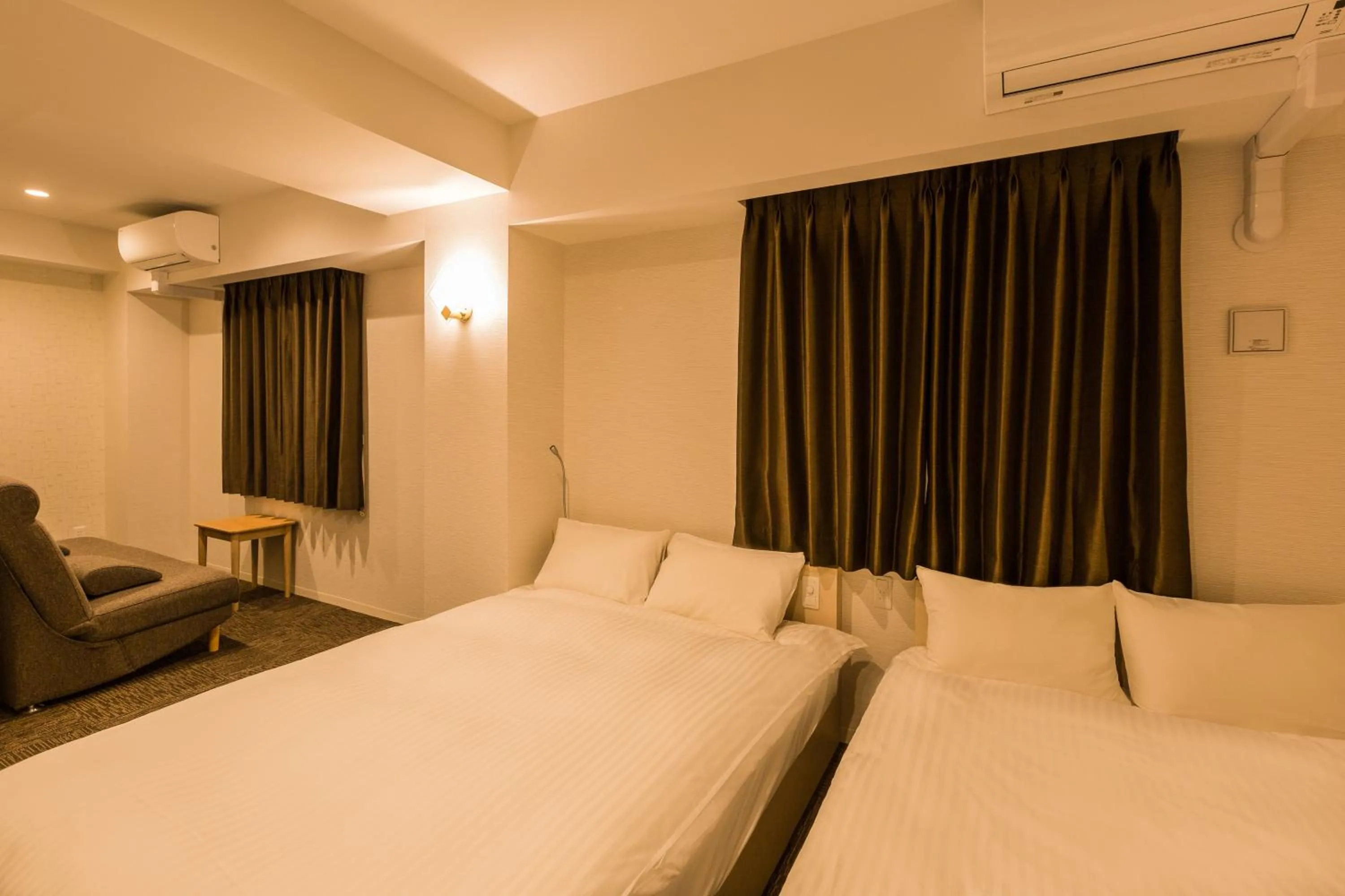 Photo of the whole room, Bed in EIWA PLACE HOTEL Hakata